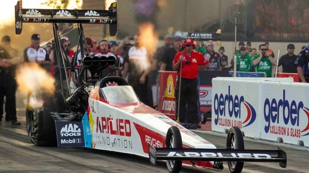 NHRA drag racing pit lane and team crew preparing Top Fuel dragster โ Kalitta Motorsports 2026 championship dominance