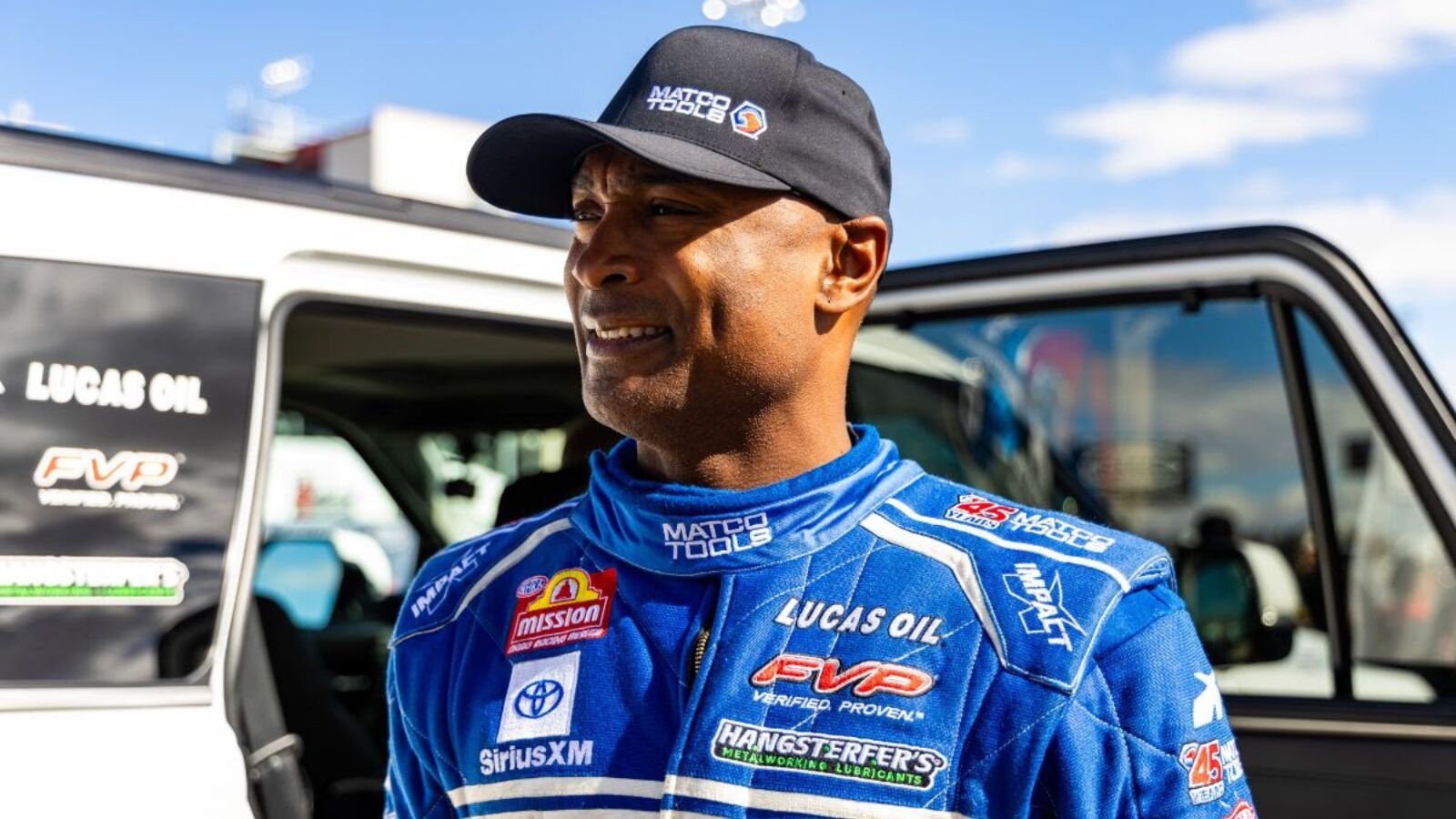NHRA Top Fuel dragster crew working on nitro engine at Summit Motorsports Park Norwalk