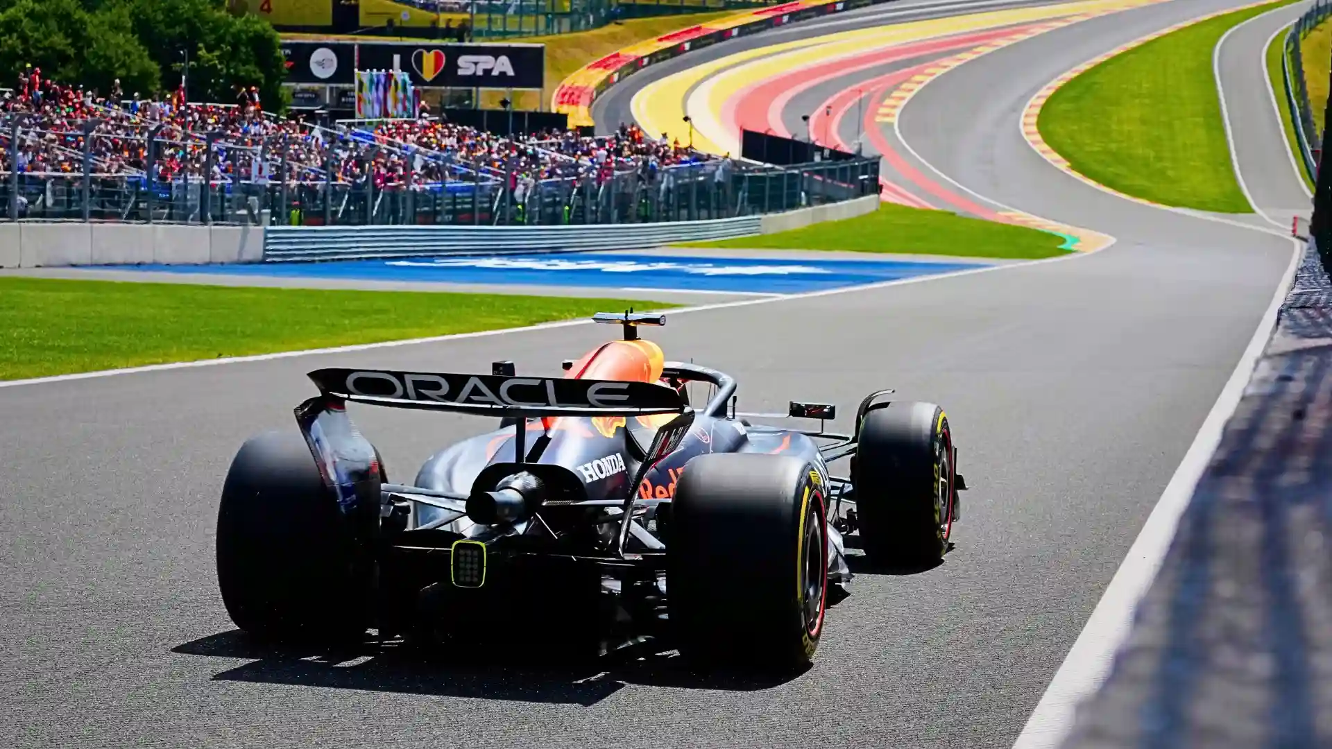 Packed grandstand crowd at a Formula 1 race weekend — representing the Belgian Grand Prix 2026 atmosphere at Spa