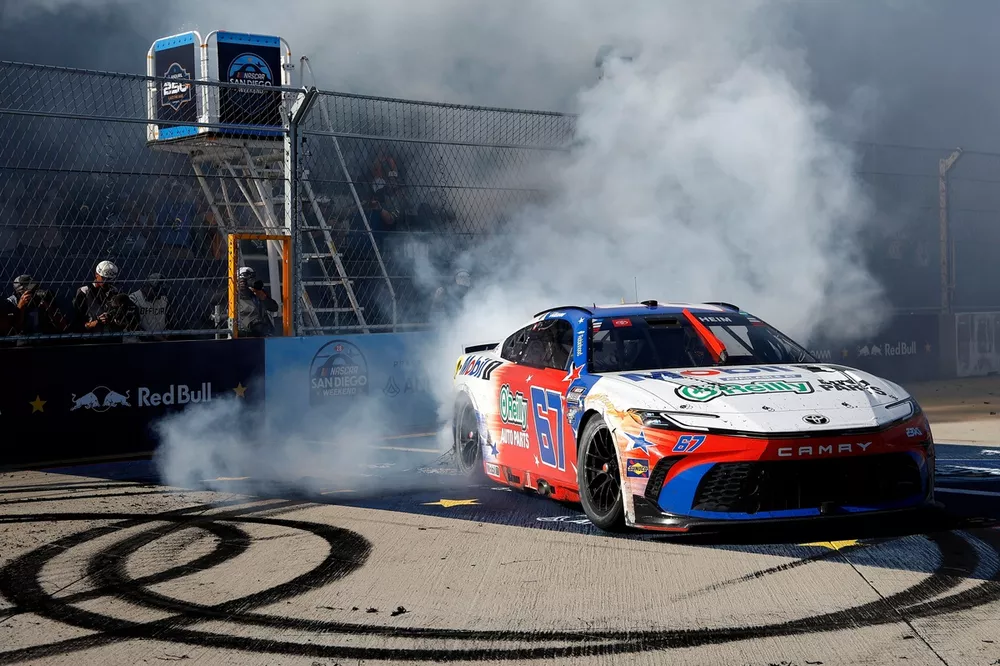 NASCAR race car doing celebratory burnout after winning the inaugural San Diego Street Race at Naval Base Coronado