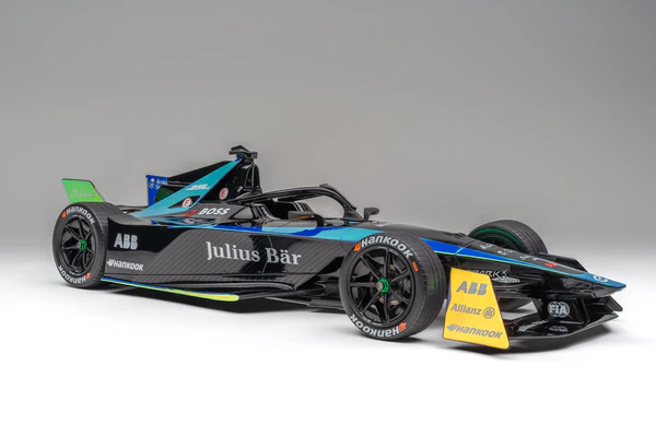 Formula E Gen3 Evo car cornering on a tight street circuit, showing low-drag bodywork designed for efficiency