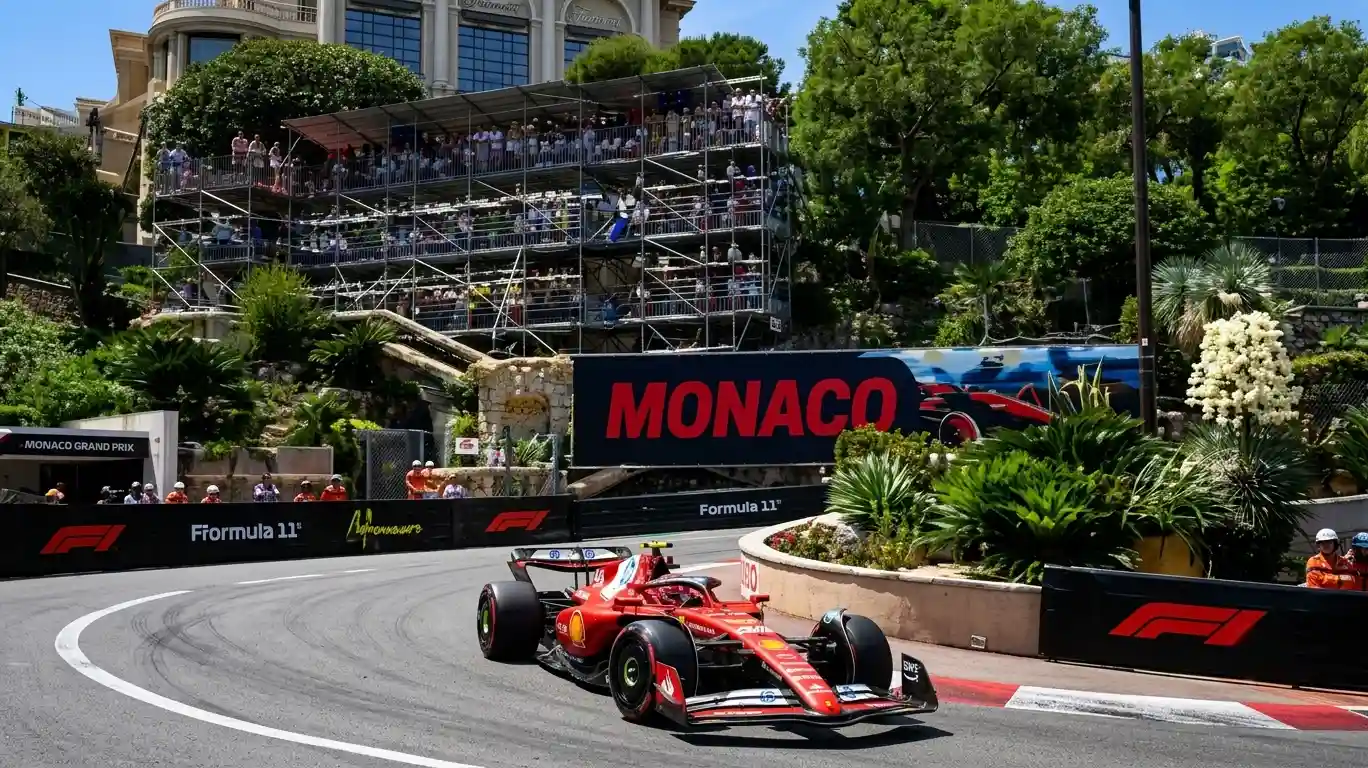Formula 1 car racing through the streets of Monaco at night — Monaco Grand Prix 2026