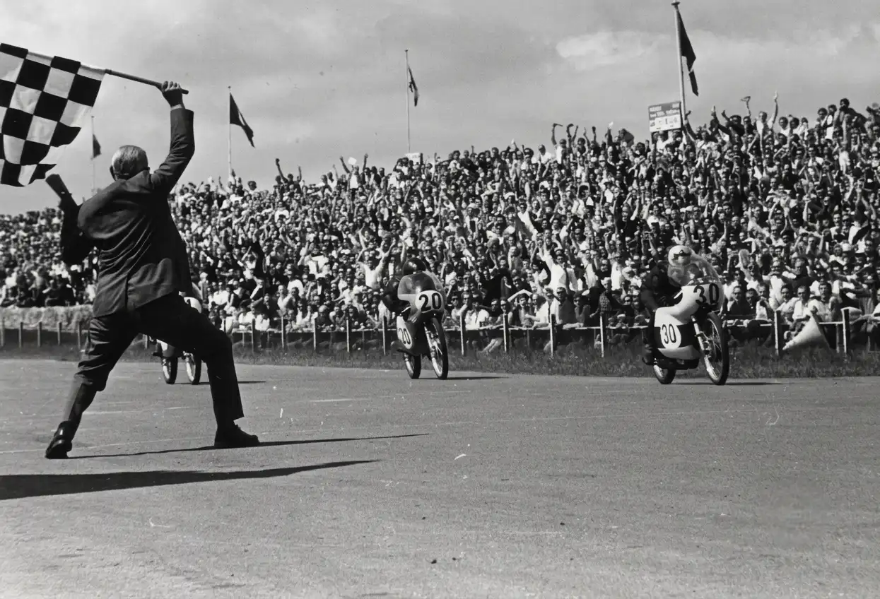 Iconic racing circuit grandstand and crowd — the Dutch TT at Assen has hosted motorsport since 1925
