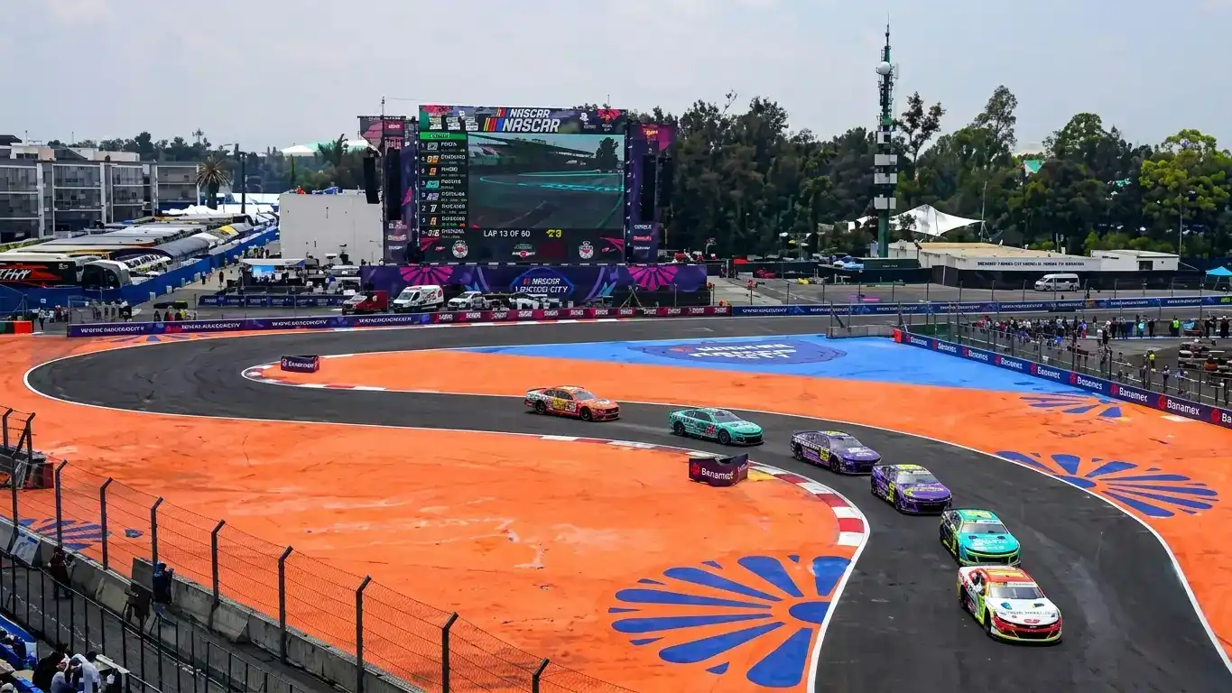 NASCAR Cup Series stock cars racing at high speed — historic Mexico City race at Autódromo Hermanos Rodríguez marks international expansion