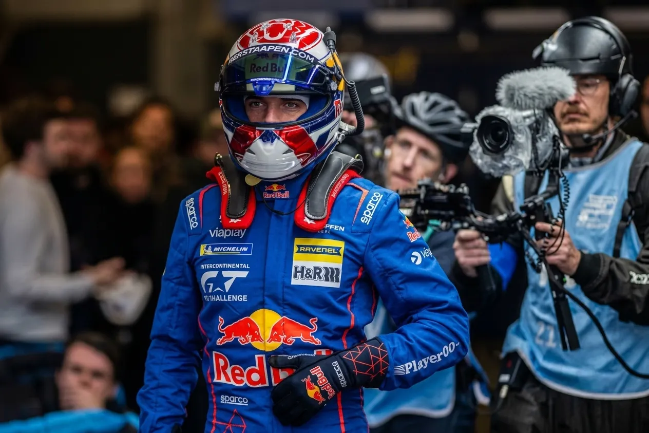 GT3 race car at speed on track at night — Max Verstappen Nürburgring 24 Hours 2026 night stint