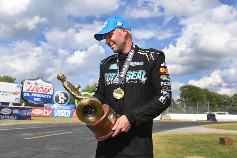 Pro Stock muscle car drag racing on track