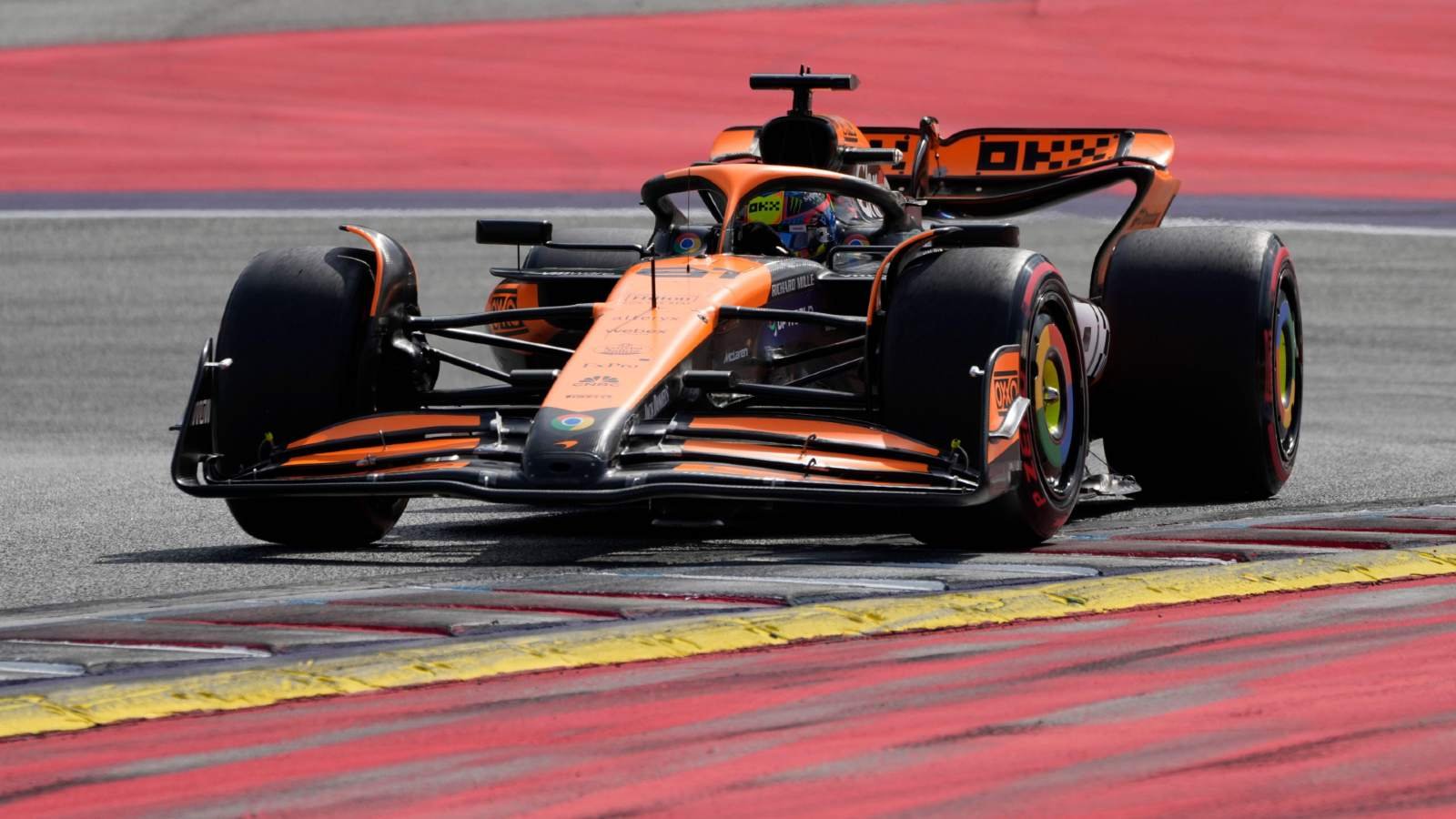 McLaren F1 car through a high-speed corner at a European circuit 2026