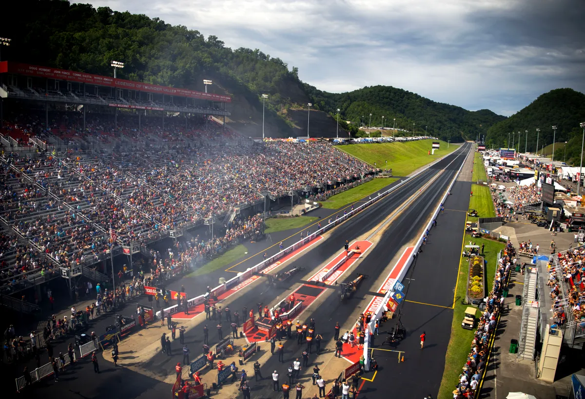 NHRA Top Fuel dragster launching at Bristol Dragway during the 2026 Thunder Valley Nationals โ Wally trophy event at the Mission Foods NHRA Drag Racing Series