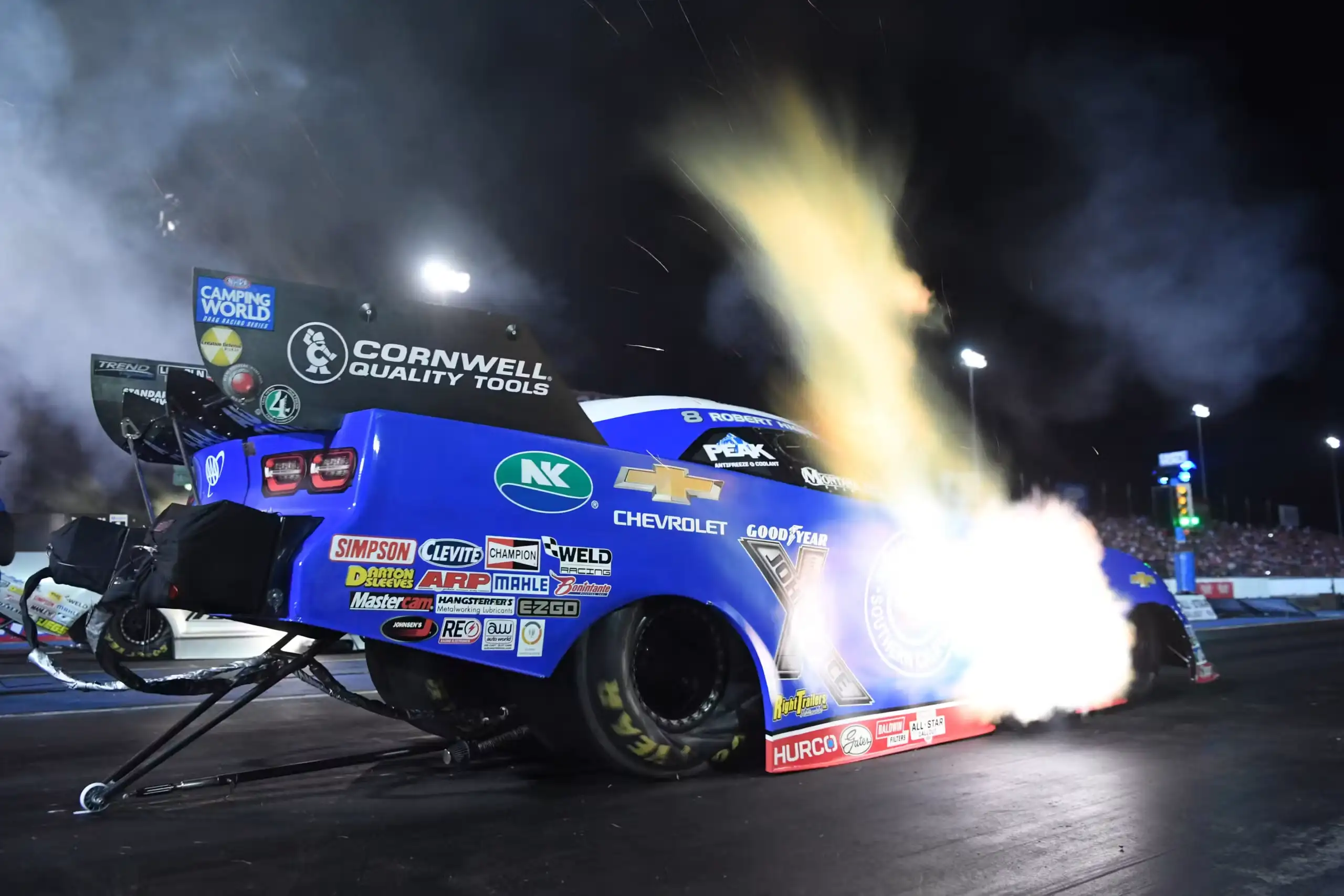 NHRA Top Fuel dragster at full throttle on a 1000-foot drag strip in the 2026 Mission Foods series