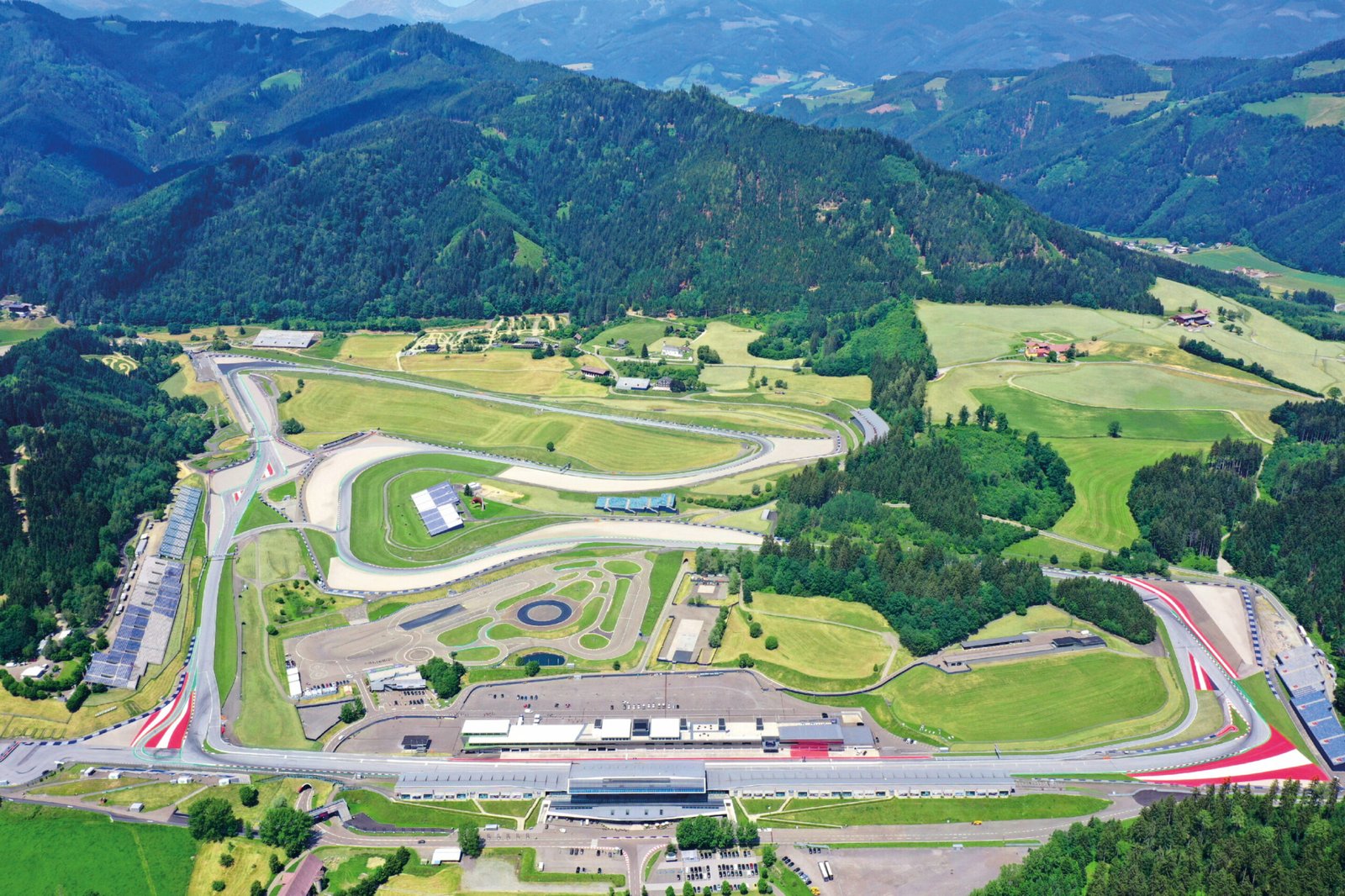 Aerial view of the Red Bull Ring circuit in Spielberg Austria surrounded by Styrian hills and mountains