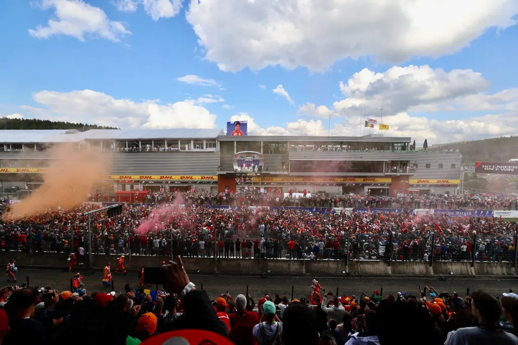 Aerial view of racing circuit grandstands packed with fans at a Formula 1 Belgian Grand Prix weekend