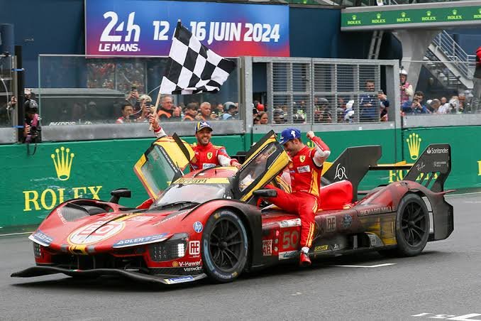 Ferrari 499P number 50 crossing the finish line at the 2026 24 Hours of Le Mans — winning moment on the Circuit de la Sarthe