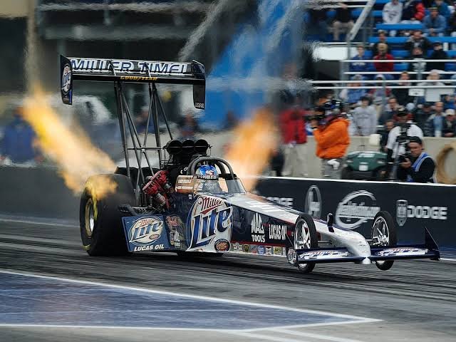 NHRA Top Fuel dragster engine close-up — supercharged nitromethane V8 producing 11,000 horsepower at full throttle