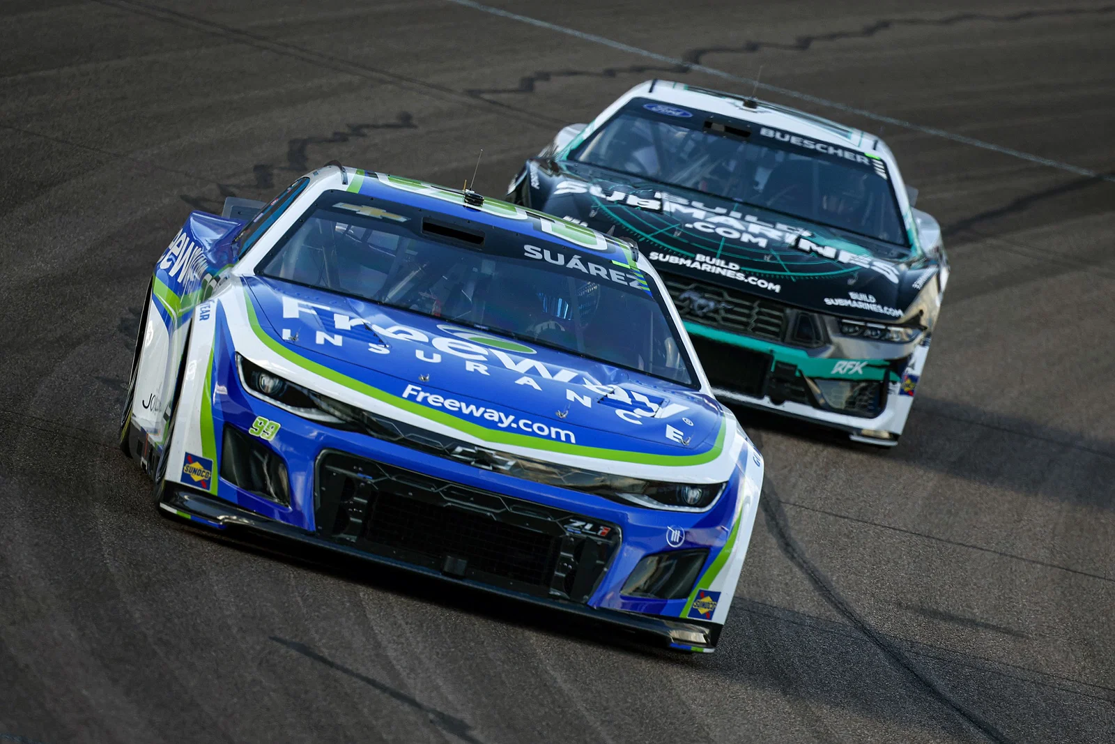 Race cars on a road course circuit — NASCAR Cup Series at Autódromo Hermanos Rodríguez Mexico City 2026 international race