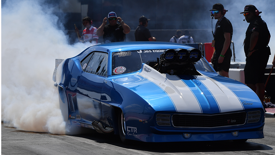 NHRA race track starting line with smoke from burnout — 2026 NHRA Mission Foods Drag Racing Series professional classes