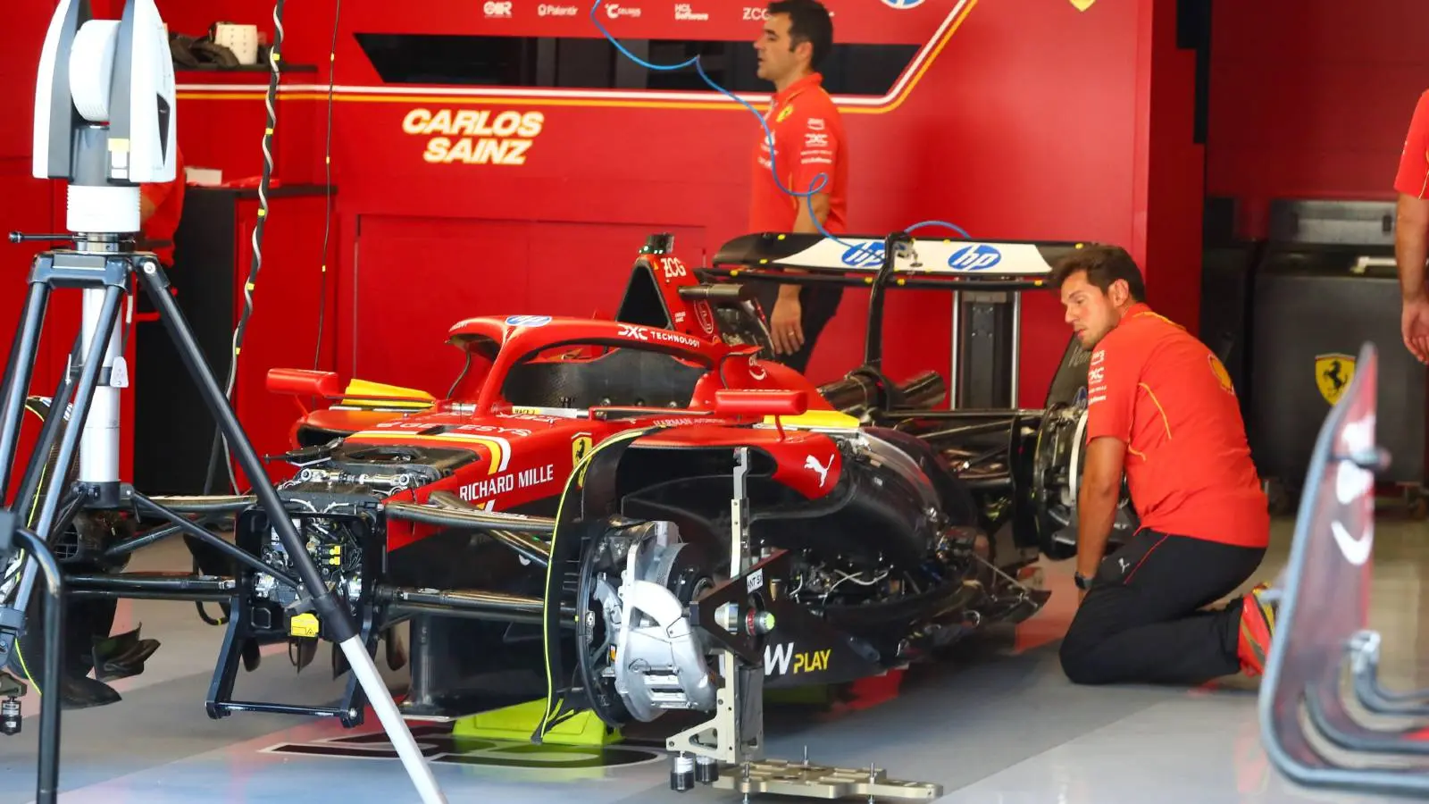 Ferrari Formula 1 car in the garage during pit lane preparation ahead of a grand prix session