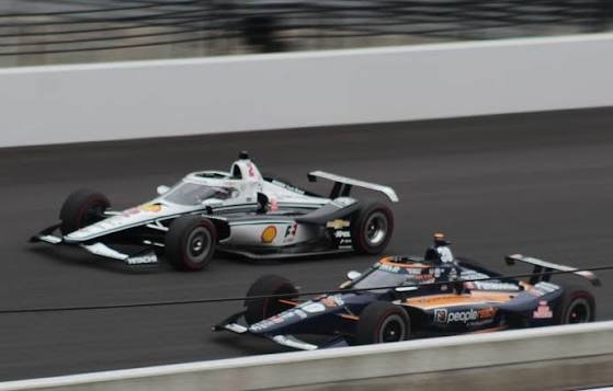 Single-seater open-wheel race car at speed — IndyCar Dallara DW12 chassis in action during the 2026 NTT IndyCar Series