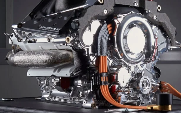 Close-up of a racing car engine components showing complex engineering and precision manufacturing