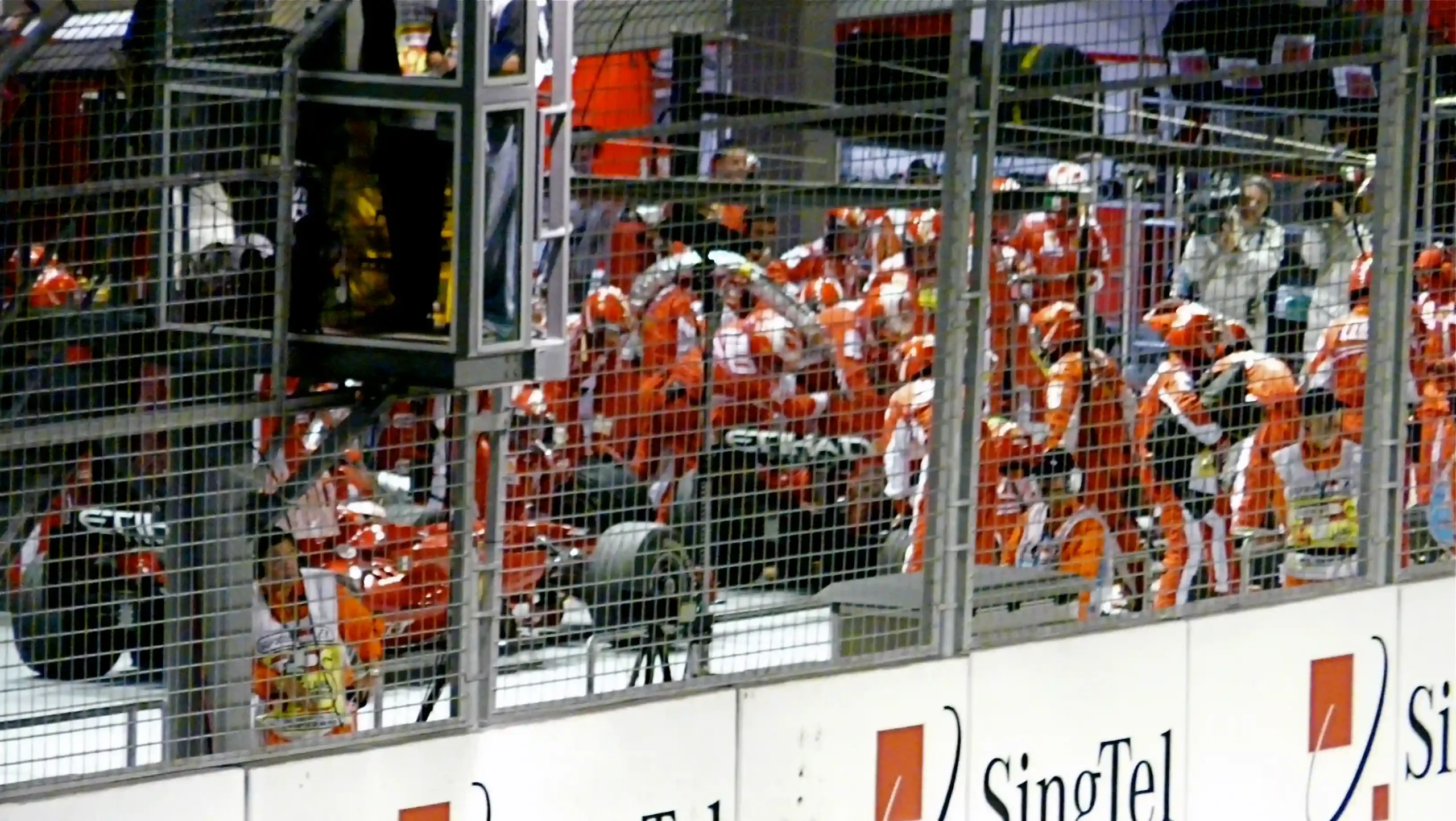 Felipe Massa leaving his Ferrari pit box with the fuel hose attached at the 2008 Singapore Grand Prix