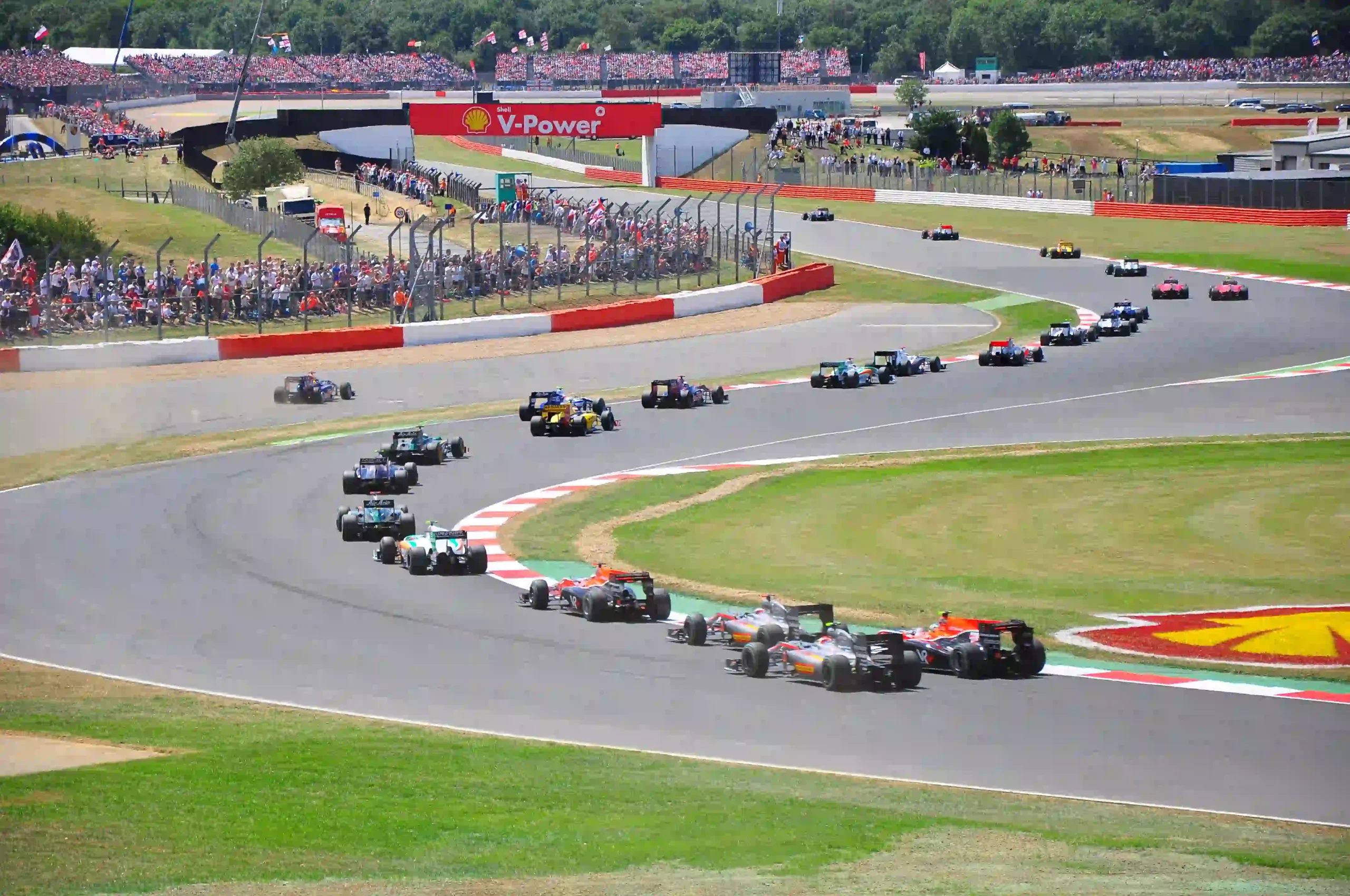 Formula 1 cars accelerating from the starting grid at the 2010 British Grand Prix