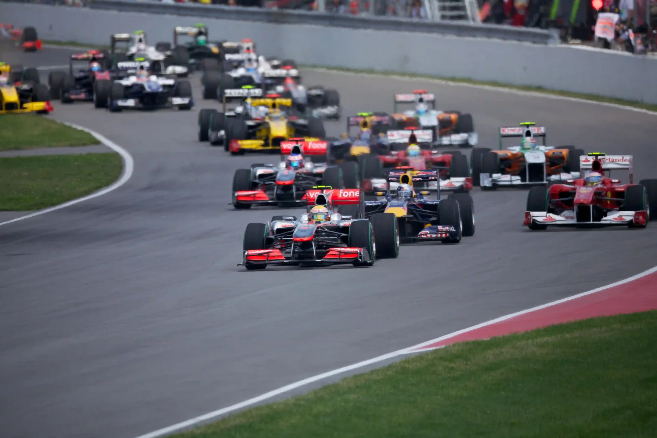Formula 1 field launching from the grid at the 2010 Canadian Grand Prix