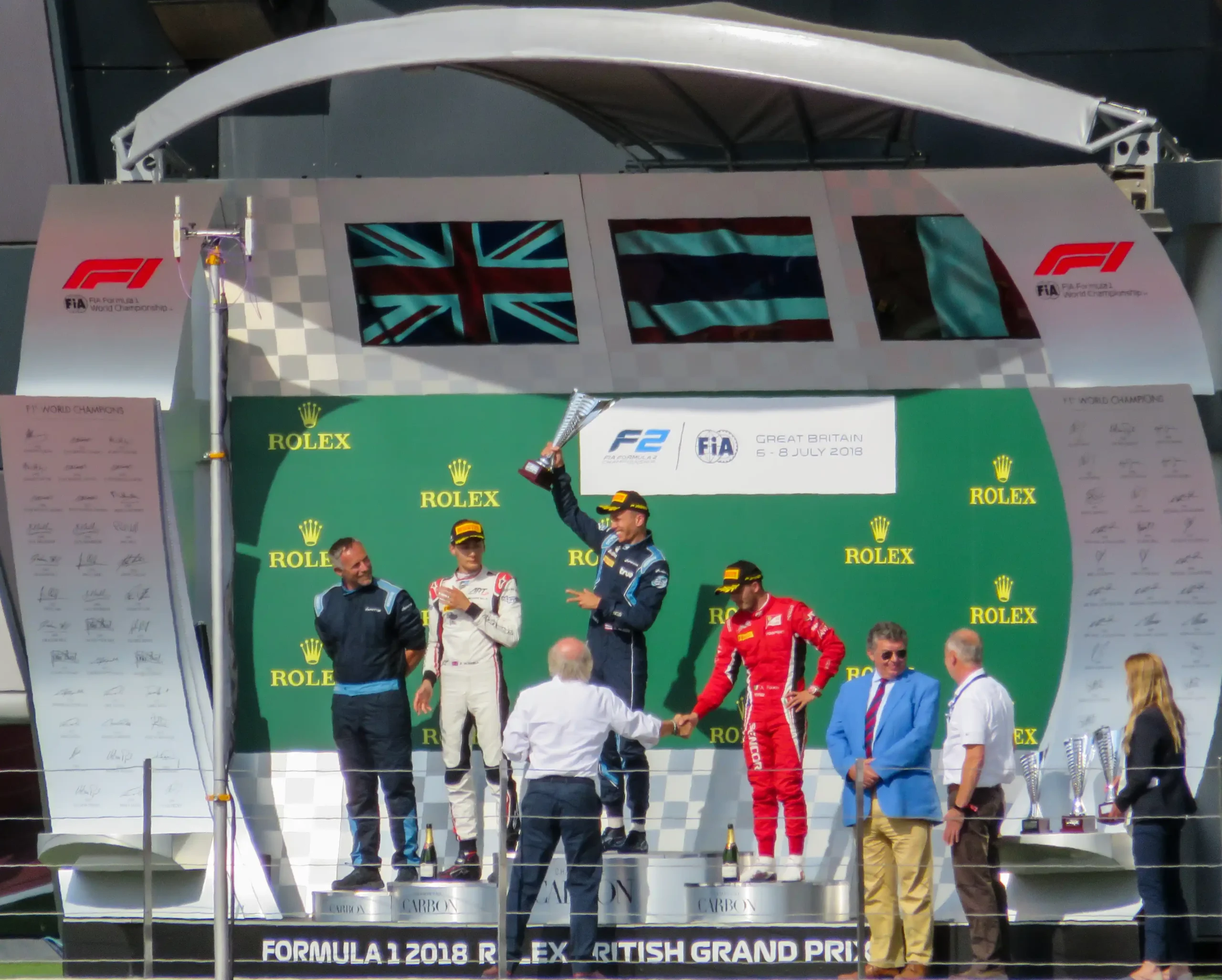 George Russell, Alexander Albon and Antonio Fuoco on the Formula 2 podium at Silverstone in 2018