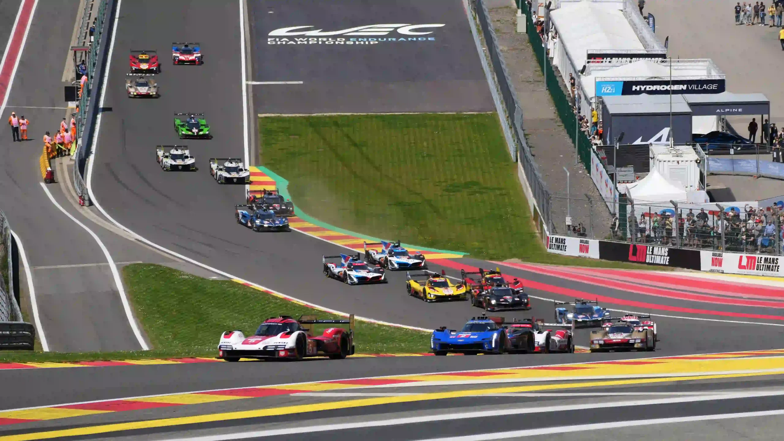 A racing field climbing through Eau Rouge and Raidillon at Spa-Francorchamps