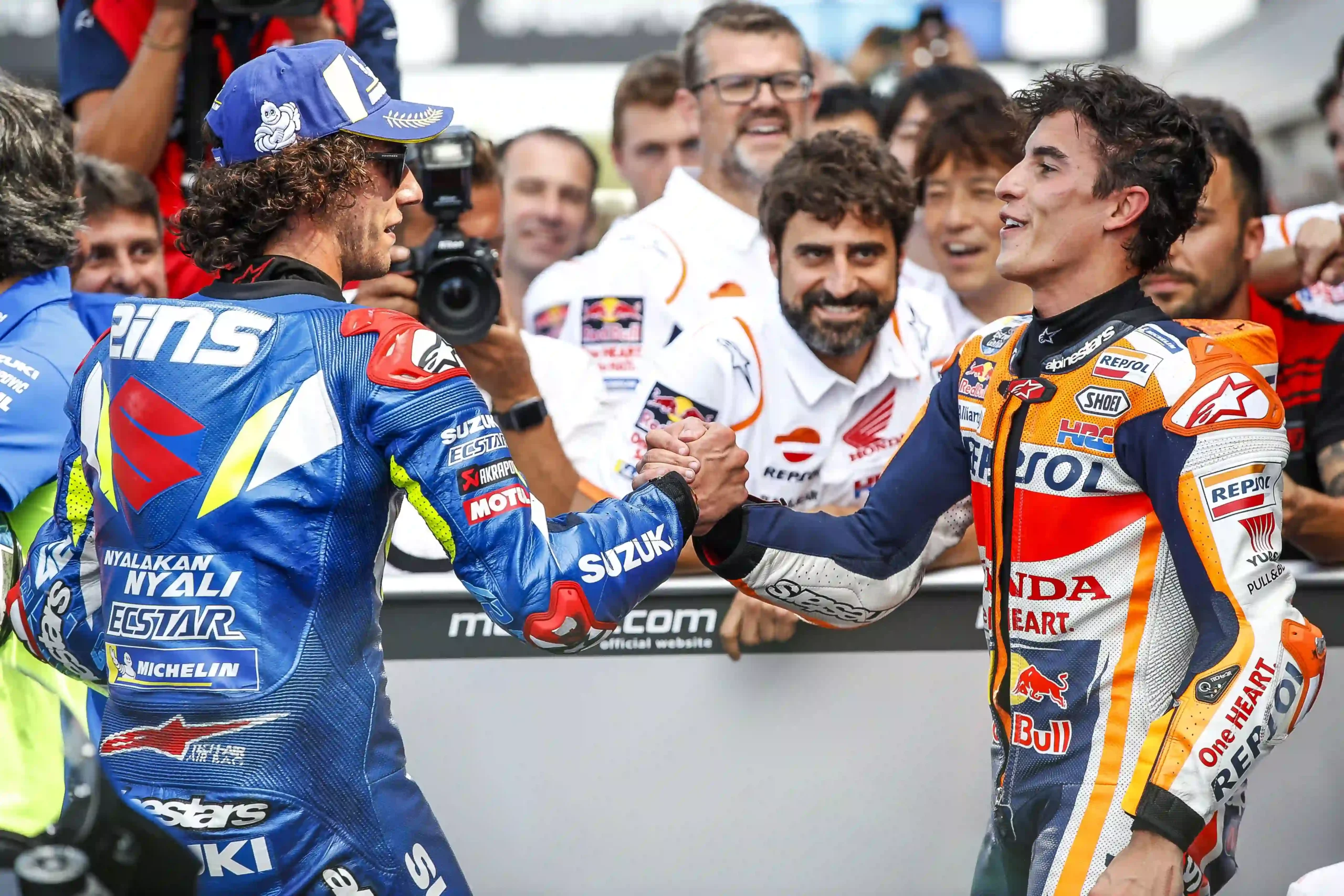 Alex Rins and Marc Marquez congratulating each other after the 2019 British MotoGP finish