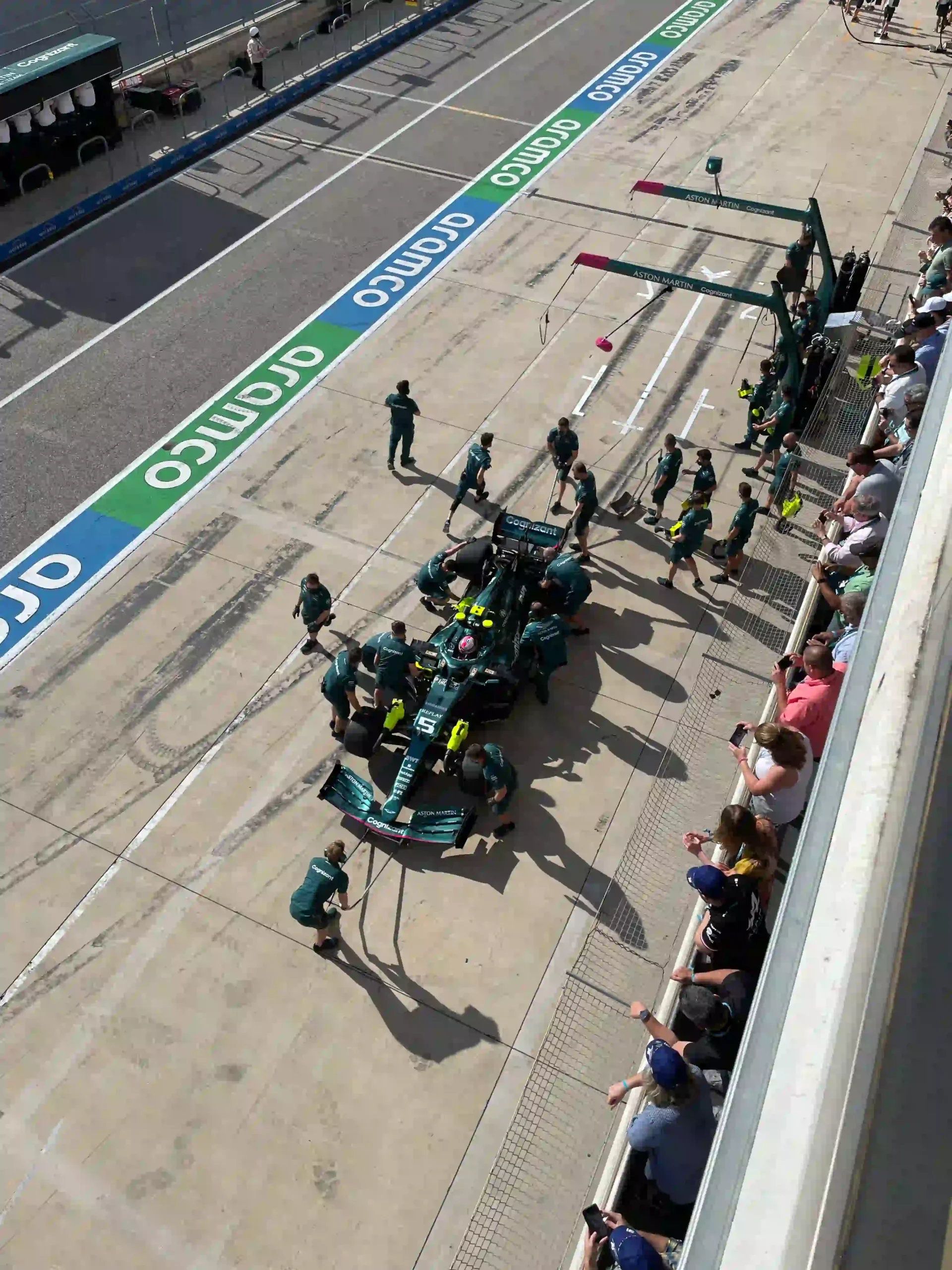 Aston Martin Formula 1 pit crew working on Sebastian Vettel's car at the 2021 United States Grand Prix
