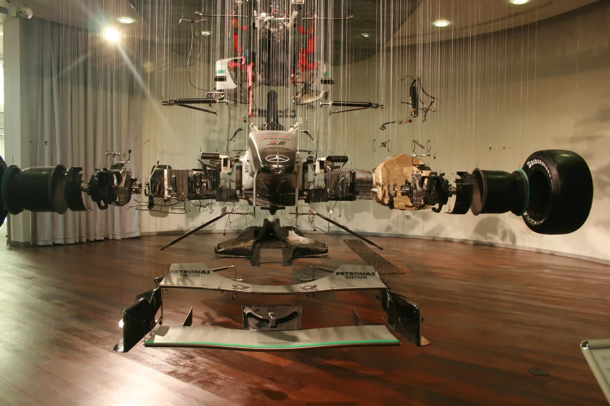 A deconstructed Formula 1 display showing the large number of components inside a race car