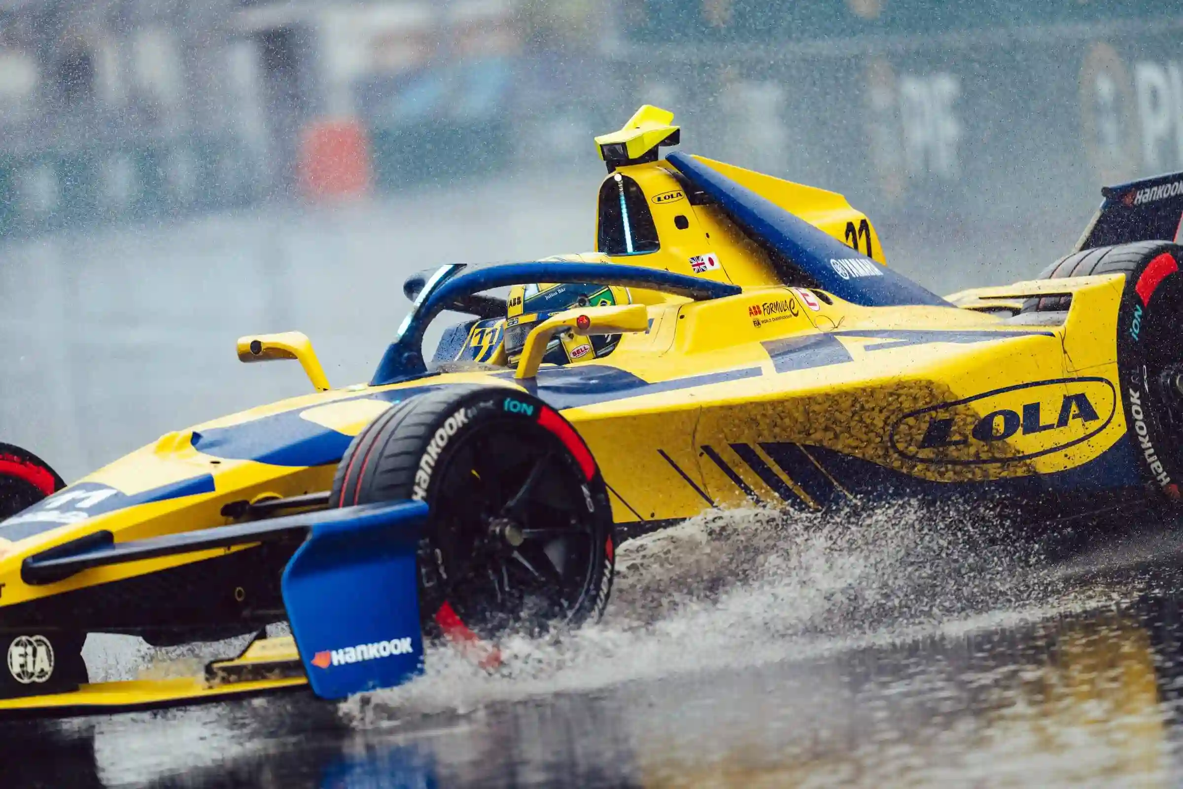 Formula E electric racing cars racing in wet conditions in Shanghai — Lucas di Grassi wins Race 2 from 20th