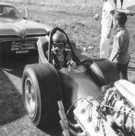 Eddie Hill seated in a front-engine Top Fuel dragster in 1966