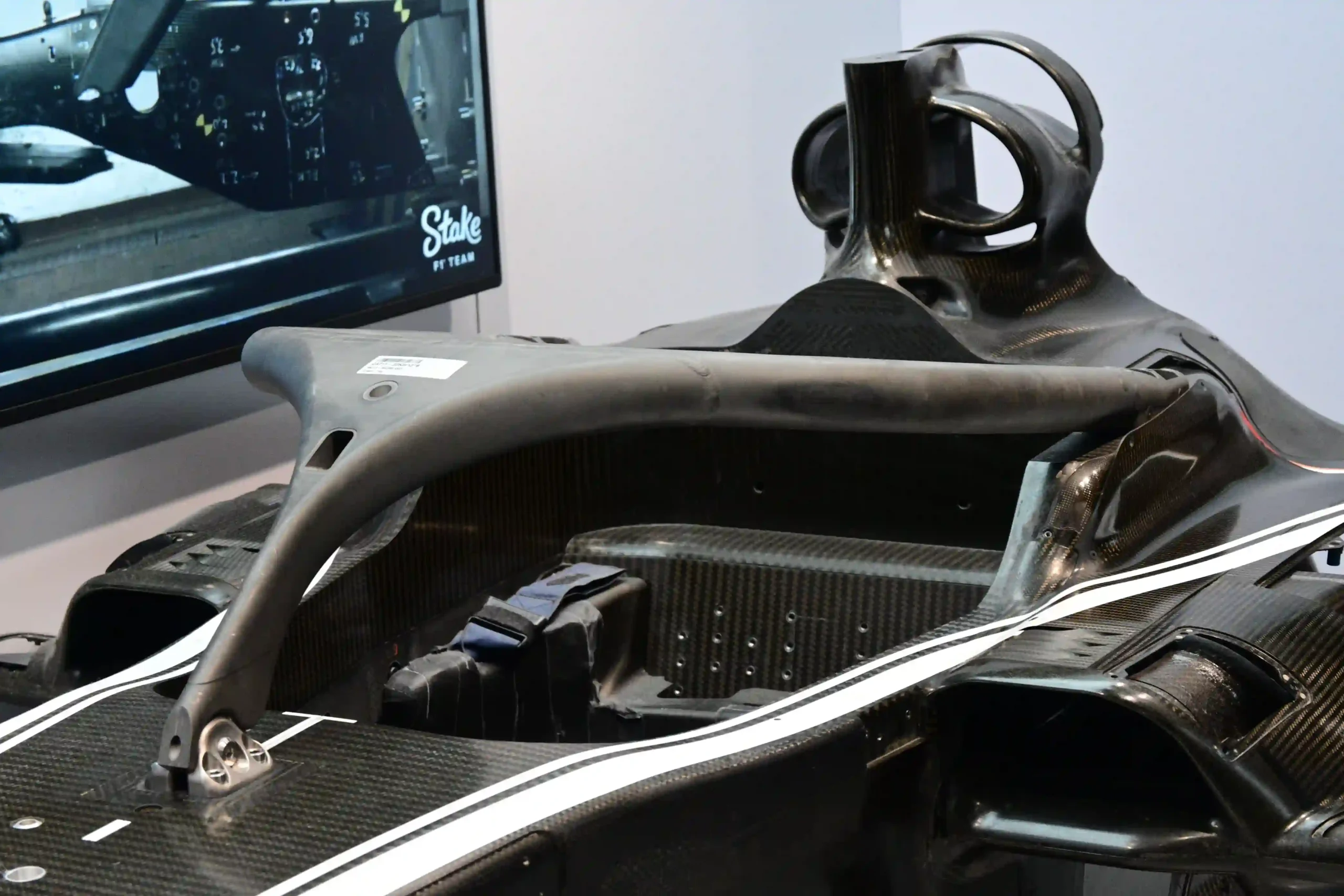 Close view of a Formula 1 Halo mounting area and carbon-fiber fairing attached to a monocoque