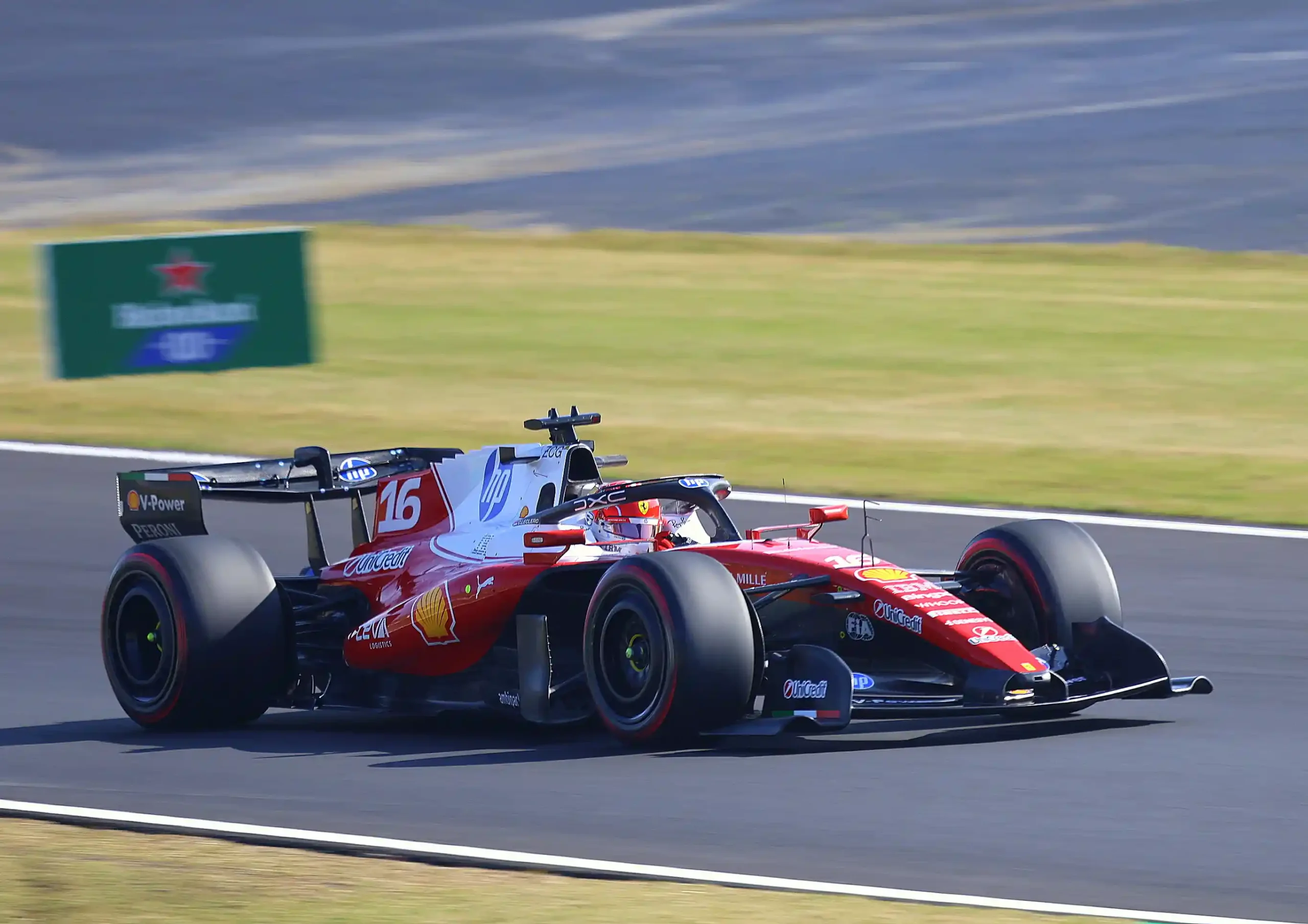 Charles Leclerc driving the Ferrari SF-26 toward Spoon Curve at the 2026 Japanese Grand Prix