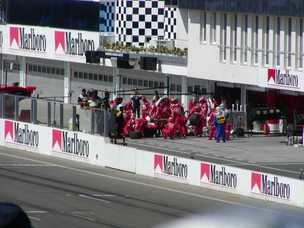 Ferrari Formula 1 pit crew completing a pit stop at the 2003 Hungarian Grand Prix