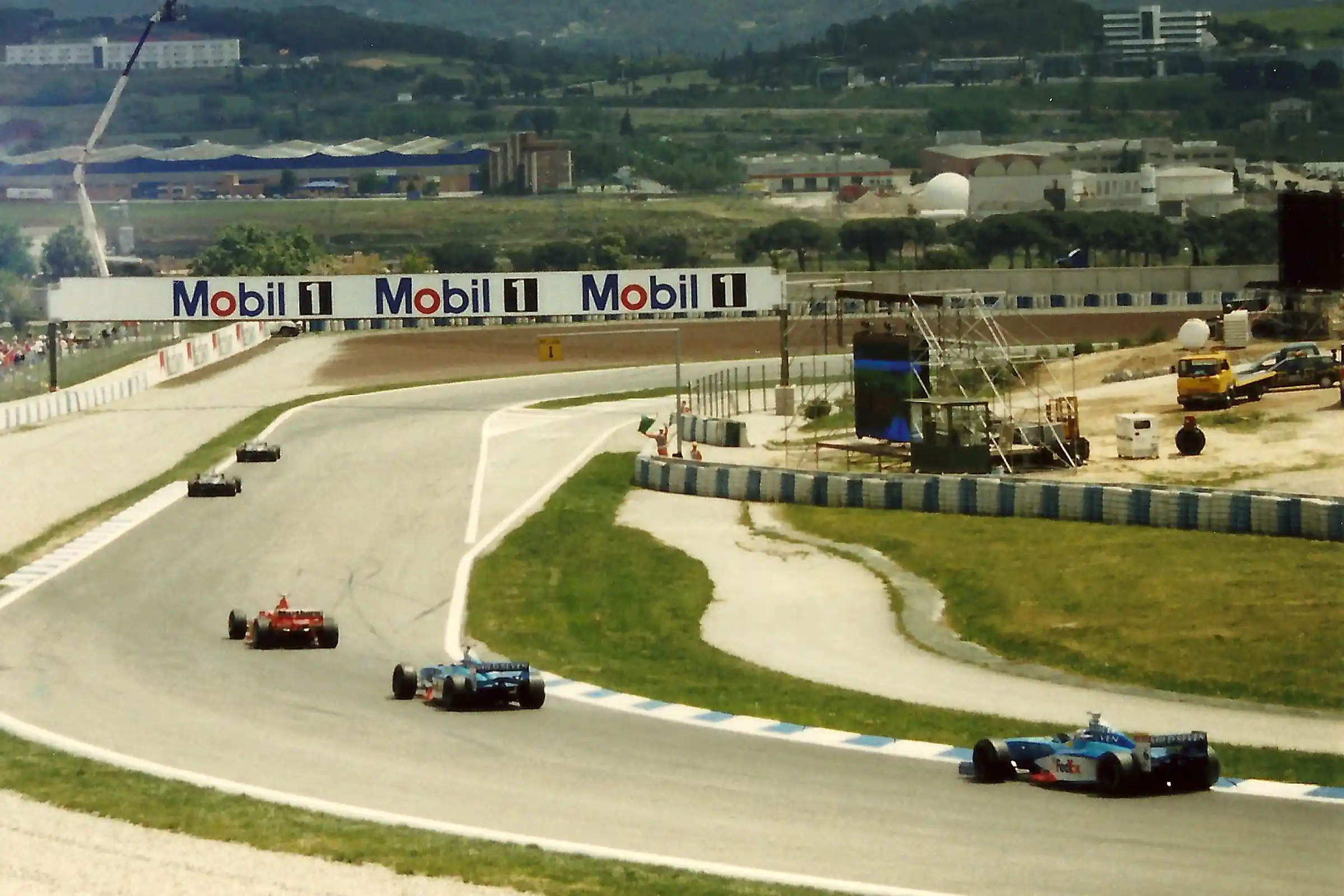 Formula 1 drivers rounding the final corner on the formation lap at the 1998 Spanish Grand Prix