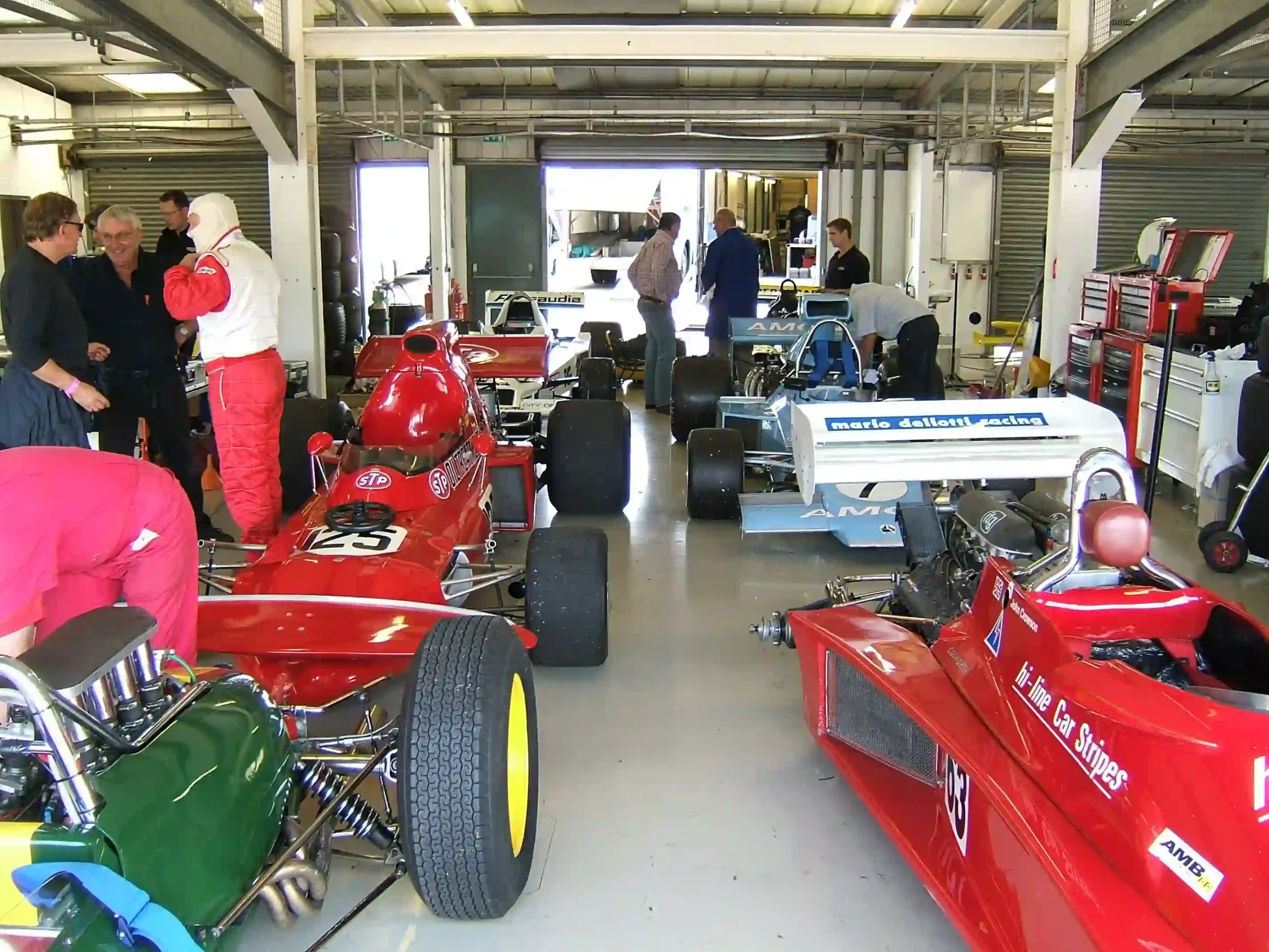 Historic Formula 1 cars and components inside a Silverstone garage