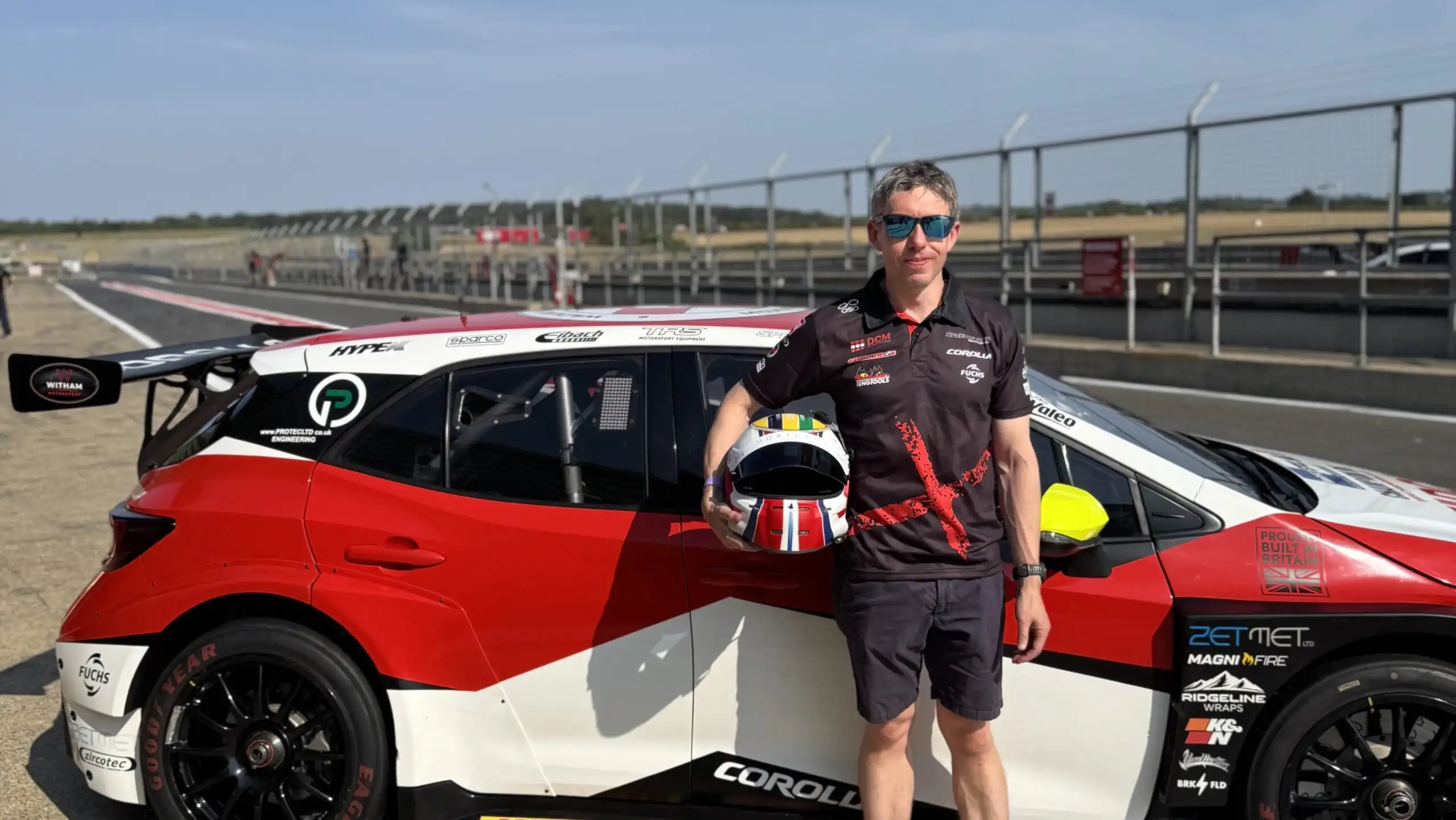 Ryan Bensley standing beside the Speedworks Corolla Racing Toyota before joining the 2026 BTCC grid