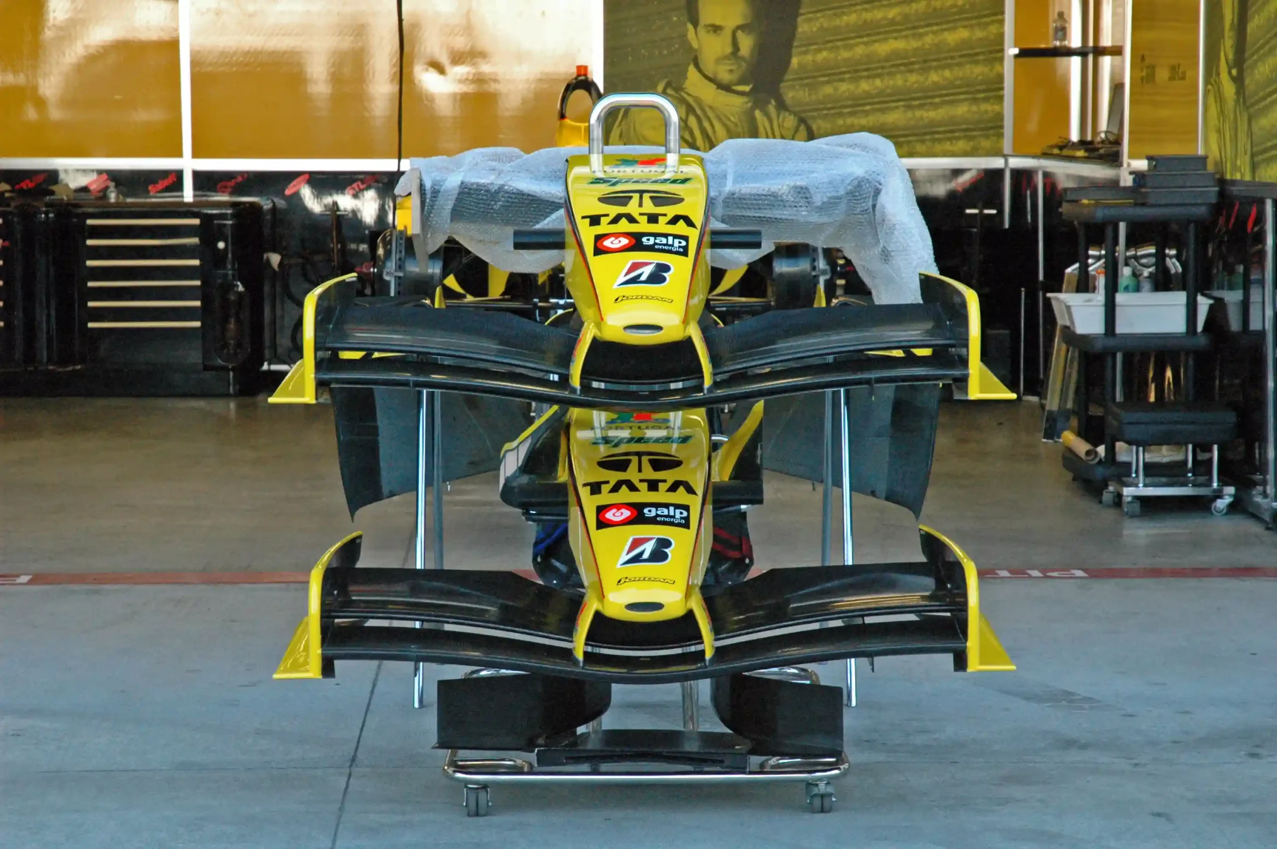 Jordan Formula 1 noses and front wings arranged inside the team garage at the 2005 United States Grand Prix