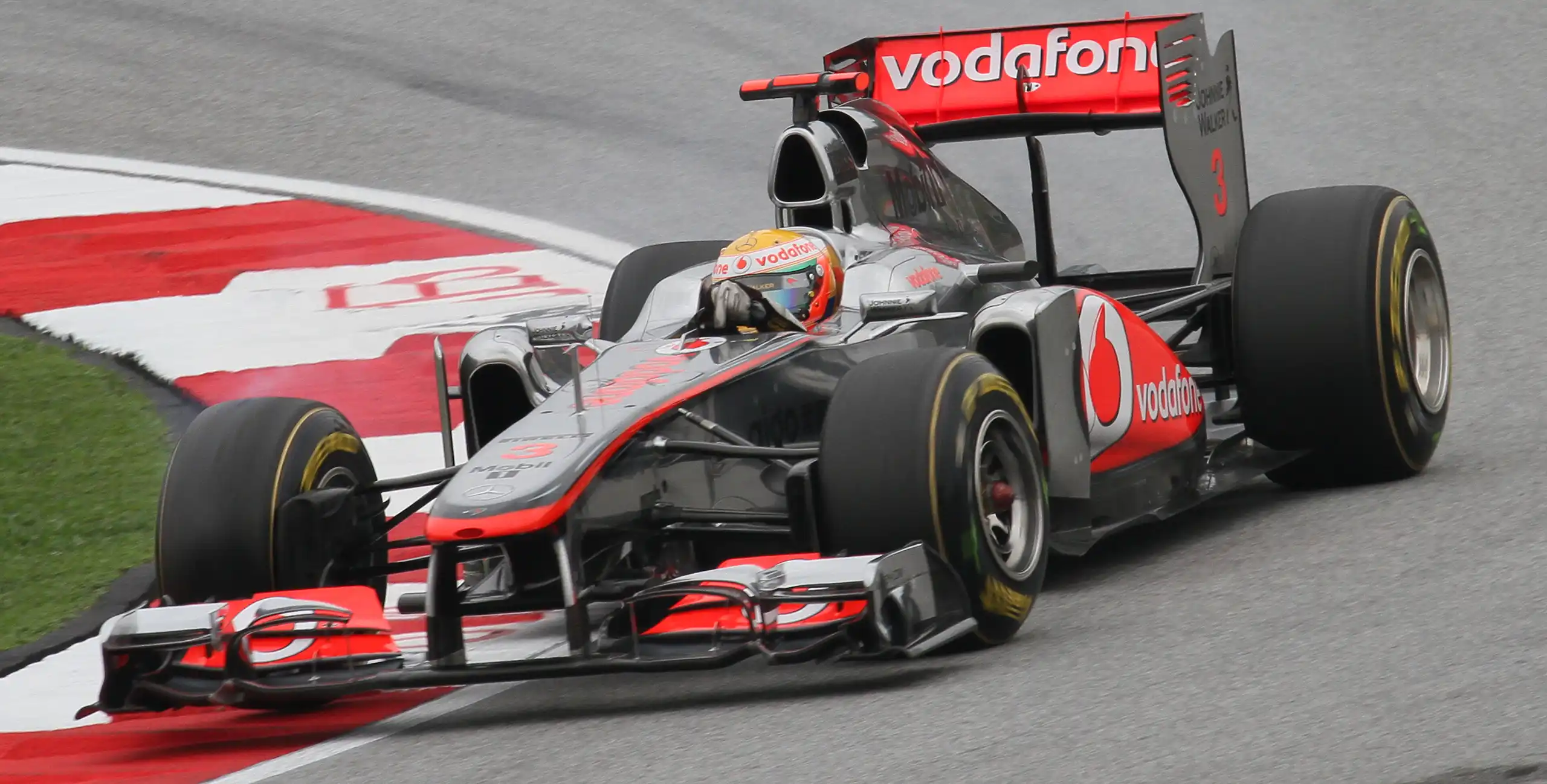 Lewis Hamilton driving a McLaren during qualifying for the 2011 Malaysian Grand Prix