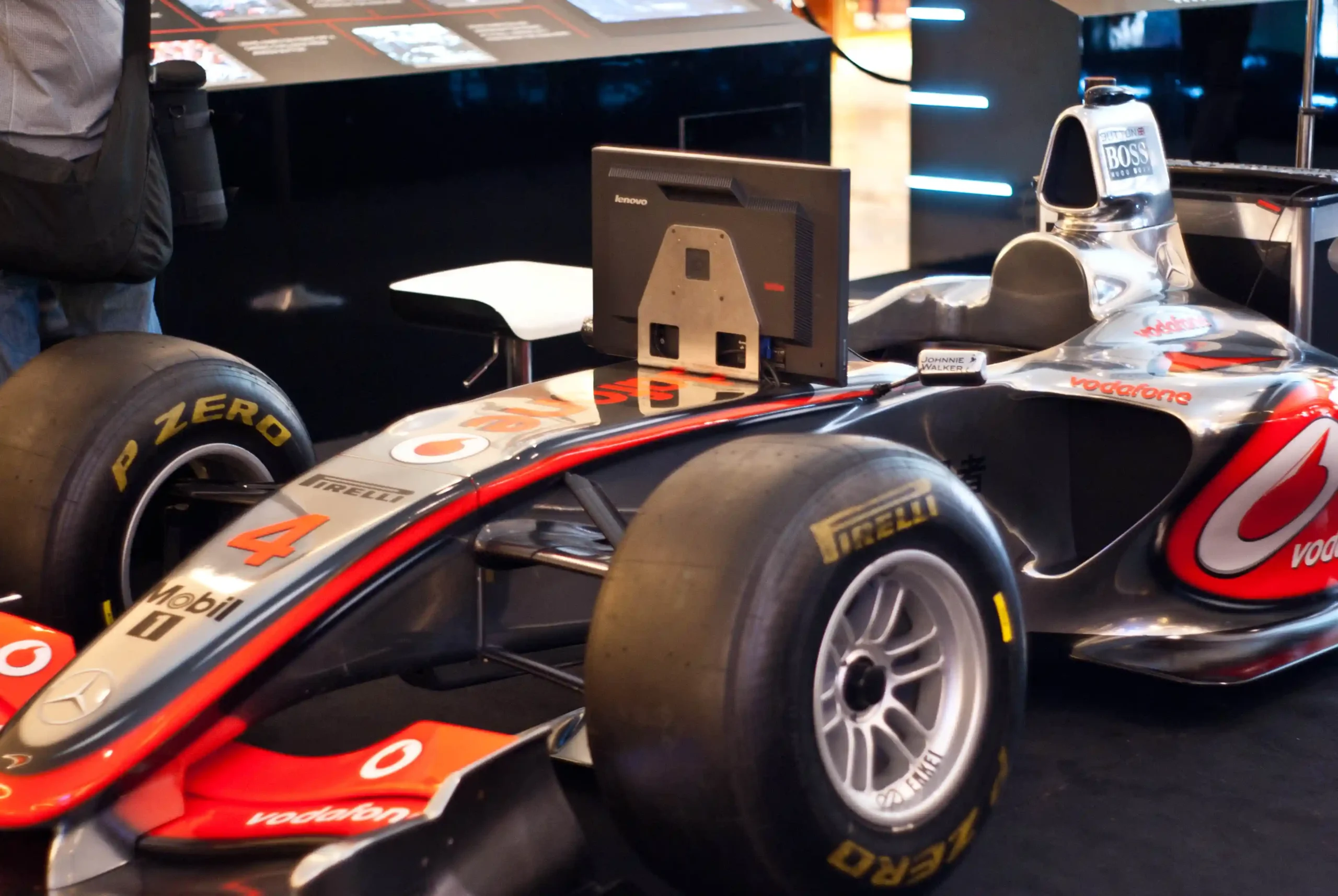 A McLaren Formula 1 simulator displayed at a 2011 event