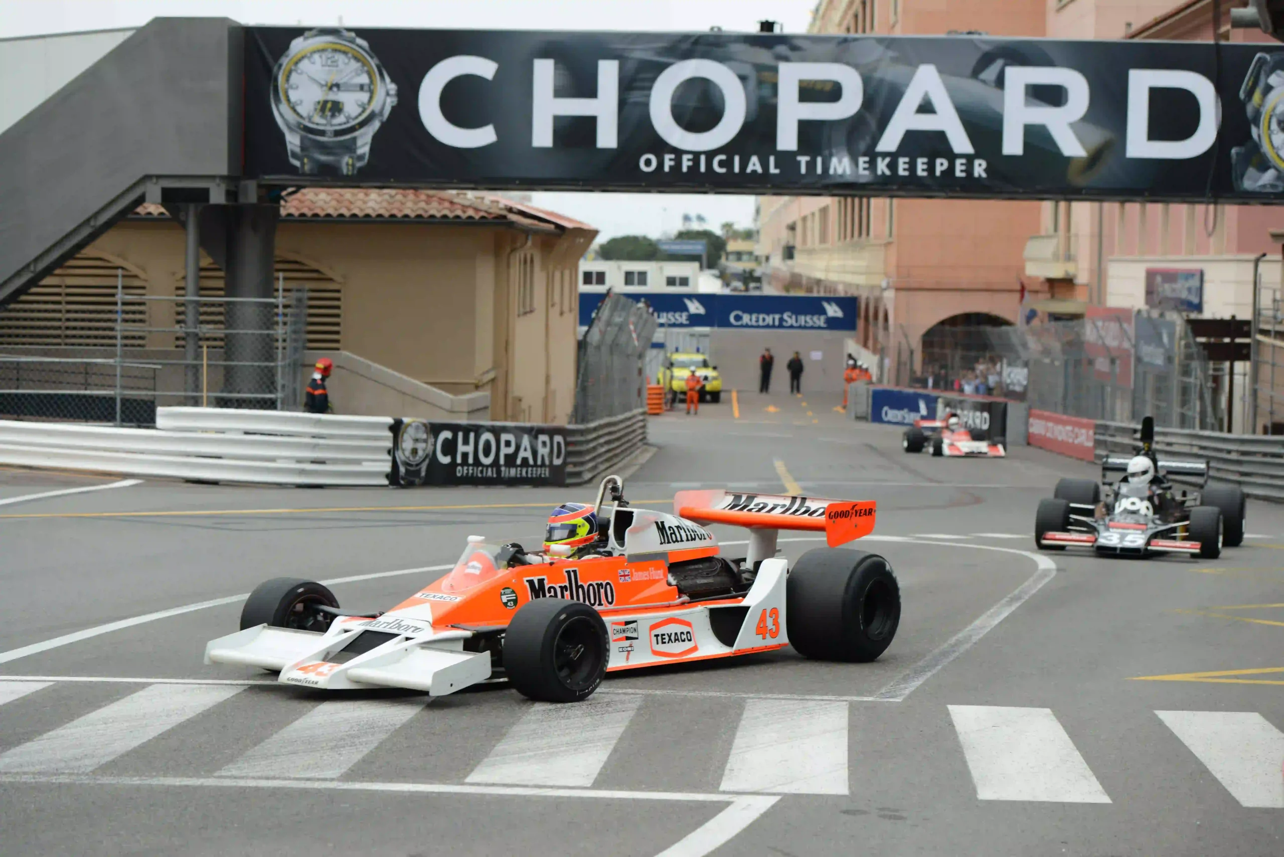 Historic Formula 1 cars racing through Monaco during the 2014 Monaco Historic Grand Prix