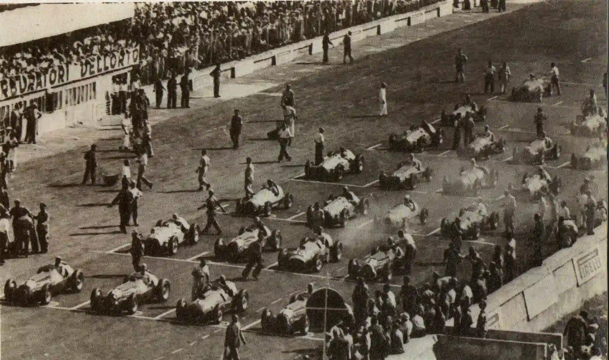 Formula 1 cars lined up on the starting grid at the 1950 Italian Grand Prix at Monza