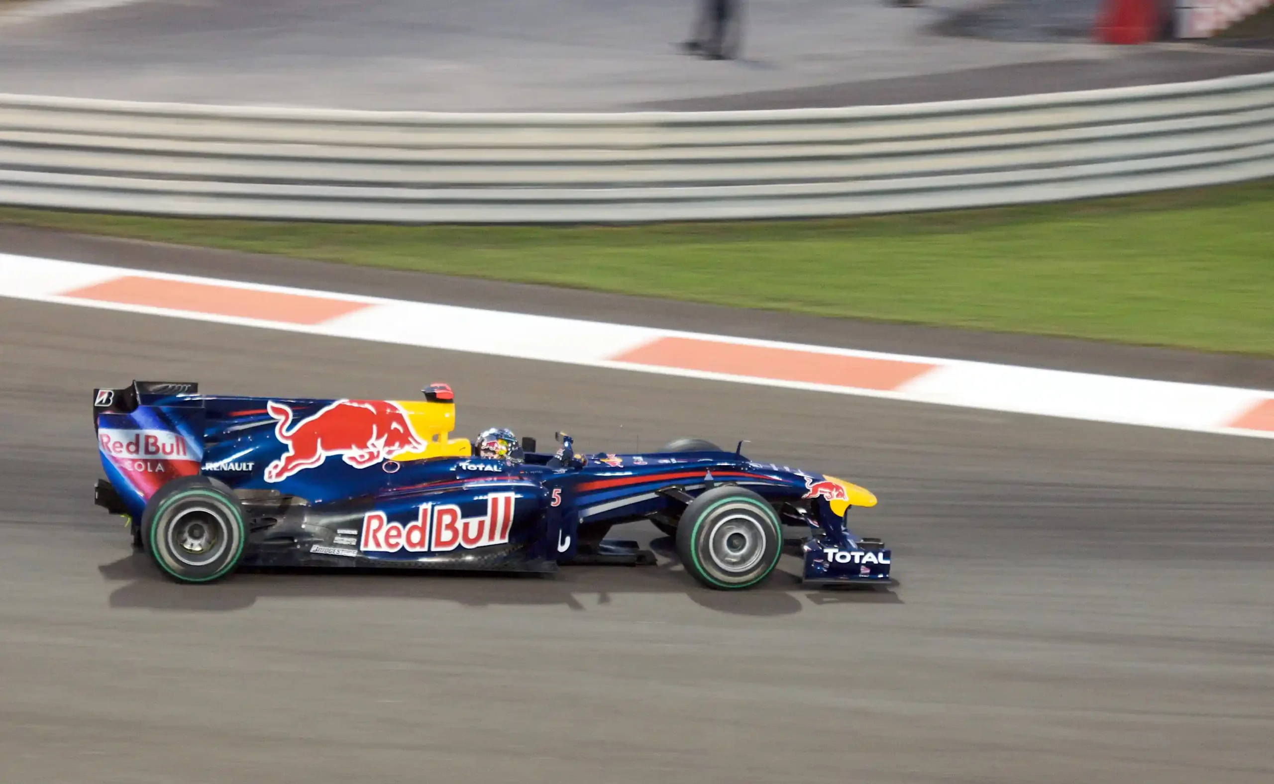 Sebastian Vettel driving the Red Bull RB6 at Yas Marina during his 2010 championship season
