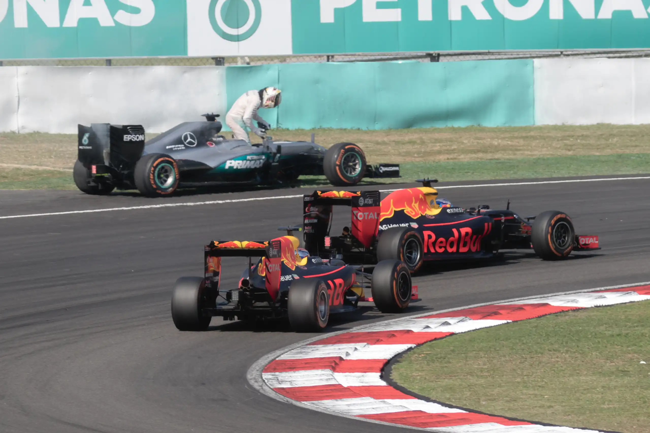 Daniel Ricciardo and Max Verstappen driving under Virtual Safety Car conditions at the 2016 Malaysian Grand Prix