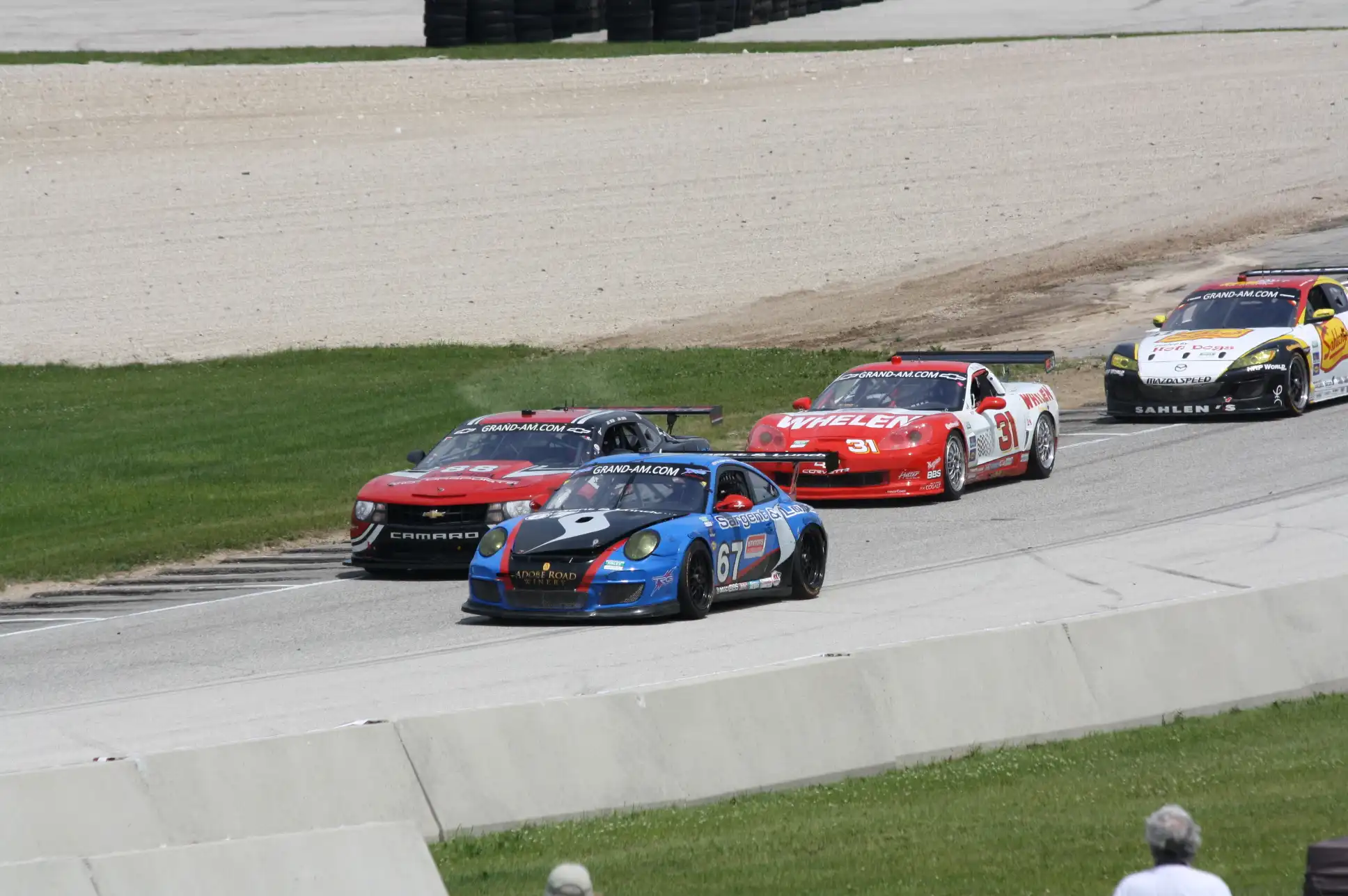 Four GT cars battling for a class victory at Road America in 2011