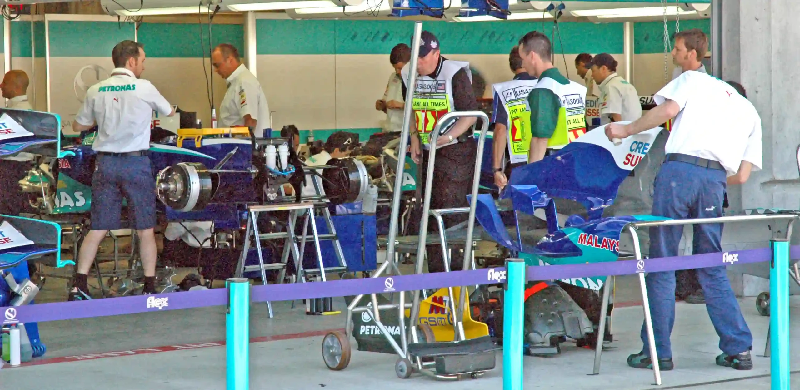 FIA scrutineers inspecting the Sauber Formula 1 garage before the 2005 United States Grand Prix