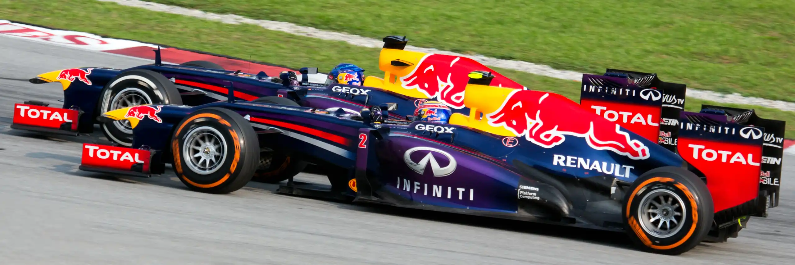 Sebastian Vettel overtaking Red Bull teammate Mark Webber during the 2013 Malaysian Grand Prix
