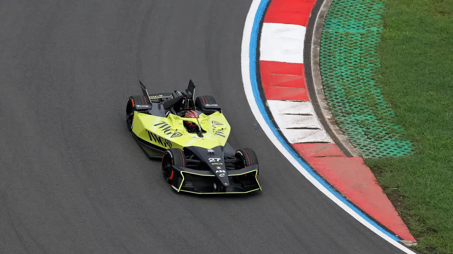 Formula E Gen3 Evo electric car racing through a wet street circuit — 2026 Shanghai E-Prix schedule and guide