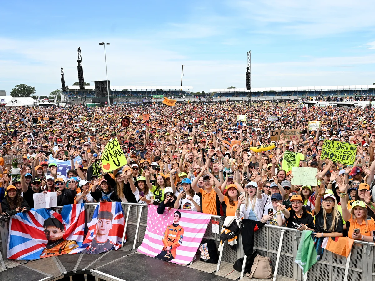 Grandstands packed with British motorsport fans at Silverstone circuit during a Formula race weekend